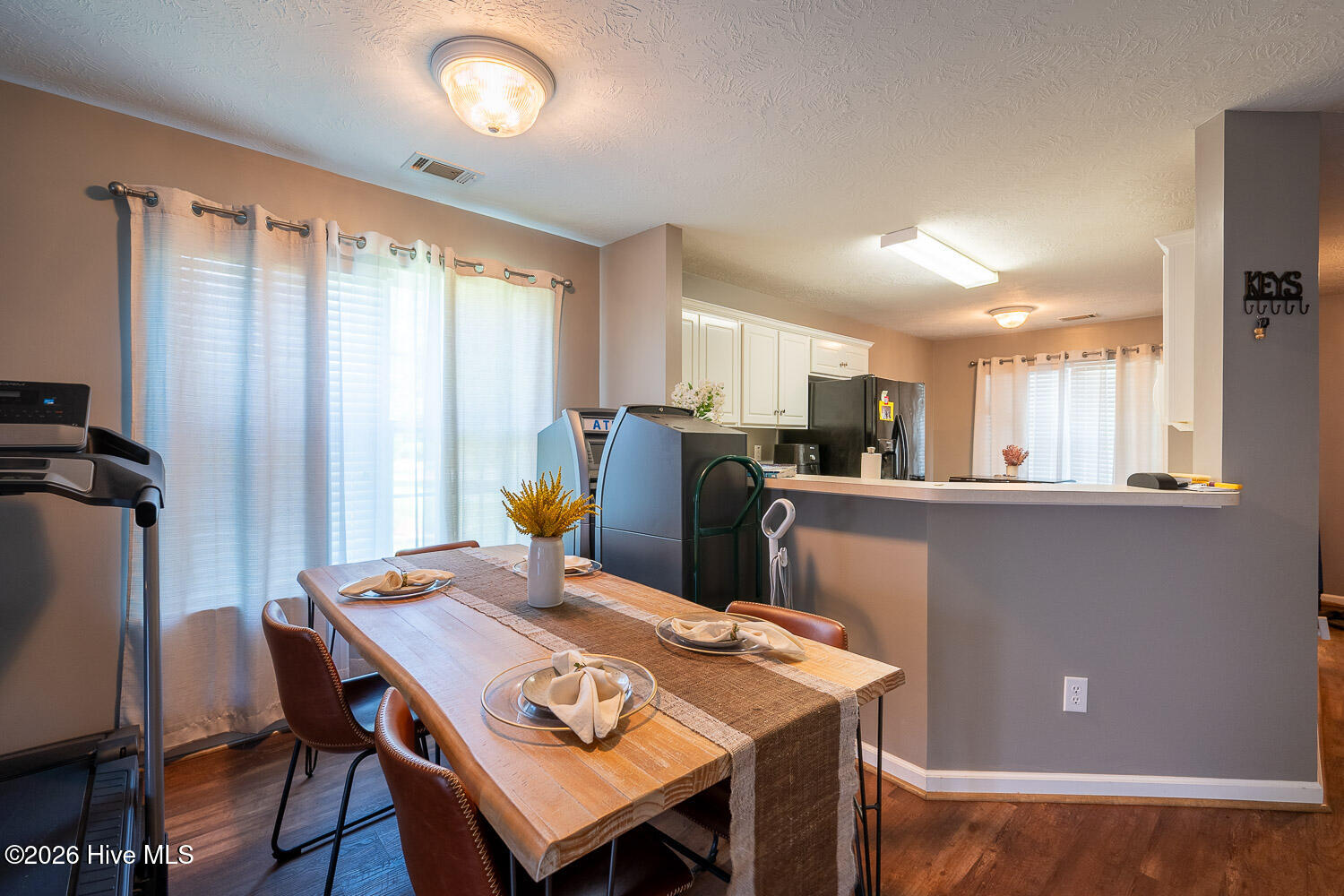 Dining area with view into kitchen