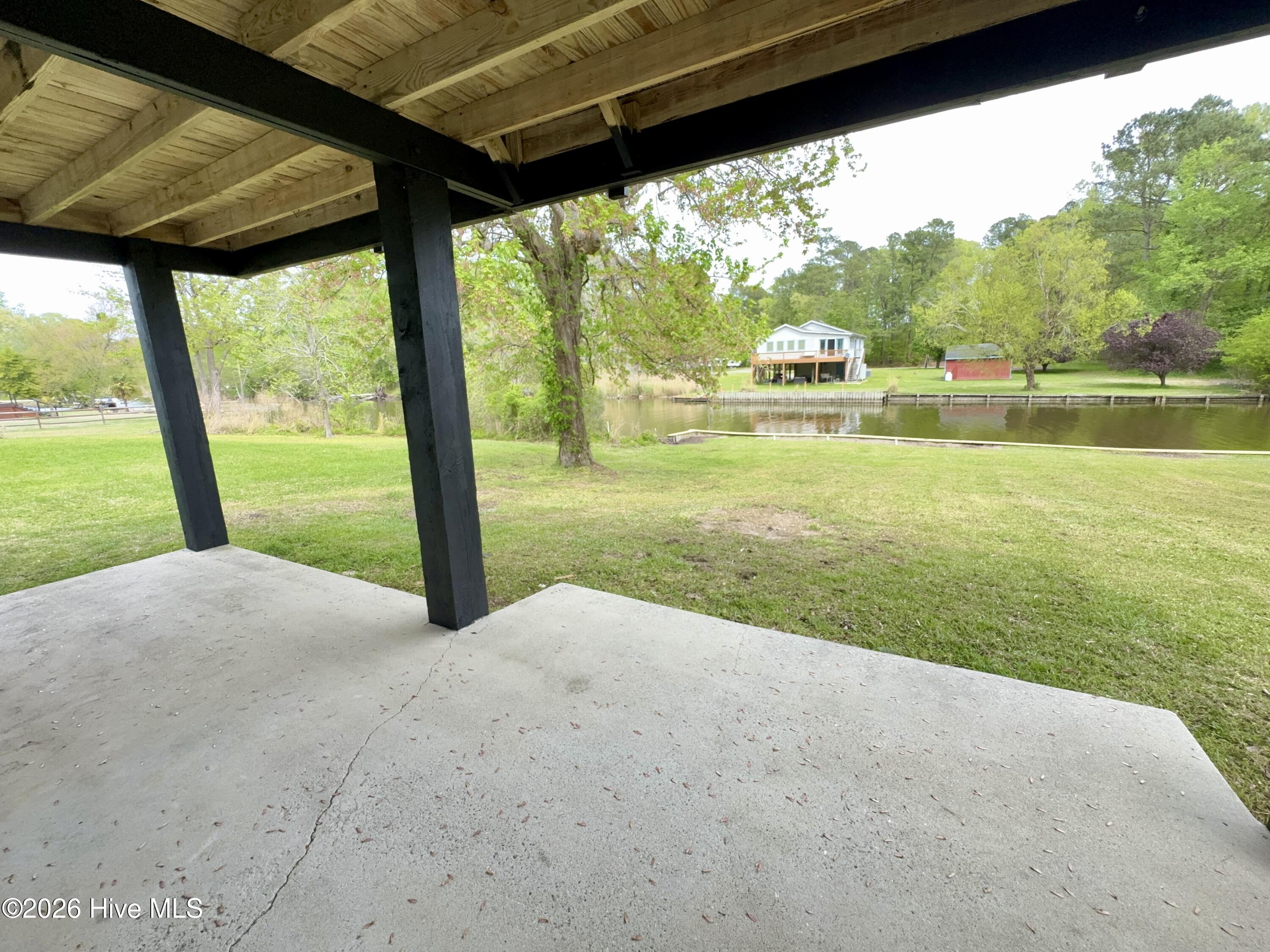 lower level covered patio over looks the canal