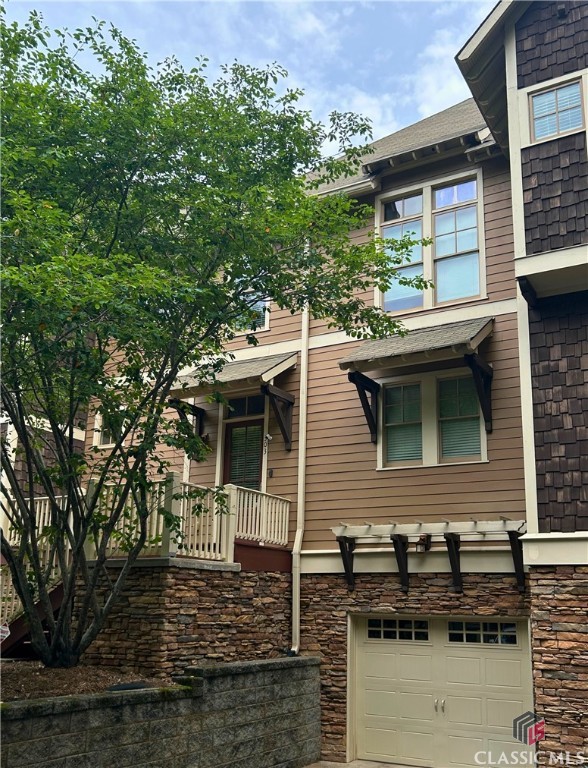 This beautifully maintained 2-bedroom, 2.5-bathroom condo in The Seasons, one of Athens’ most desirable condo communities, is a rare find! Featuring private parking in an attached GARAGE, this move-in ready condo is conveniently located just minutes from UGA, Five Points, and Downtown Athens. this home offers the perfect blend of comfort, style, and convenience and has easy access to shopping, dining, public transit, and UGA’s campus. This condo is ideal for students, professionals, or investors looking for a prime Athens location, and it also makes the perfect second home for Georgia fans looking for a convenient spot to stay on game weekends or for those who love visiting Athens throughout the year!  Step inside to an inviting open-concept living space featuring recently refinished, beautiful hardwood floors, abundant natural light, and a seamless flow between the living, dining, and kitchen areas. The spacious kitchen boasts granite countertops, stainless steel appliances, and ample cabinet space—perfect for entertaining or everyday living. A half-bath on the main level adds extra convenience for guests.  Upstairs, you’ll find two generously sized bedrooms, each with its own private en-suite bathroom and spacious closets. The laundry room is advantageously located on the second floor. There is a large storage room in the basement, perfect for stowing all of your tailgating essentials or could easily be used as a fitness room or other creative space.  A large partially covered back patio offers a space to relax and entertain outside.  Don’t miss this incredible opportunity to own a prime Athens condo in The Seasons! Schedule your private showing today.  AGENTS: PLEASE SEE REALTOR PRIVATE REMARKS/SHOWING INSTRUCTIONS FOR ACCESS. xx