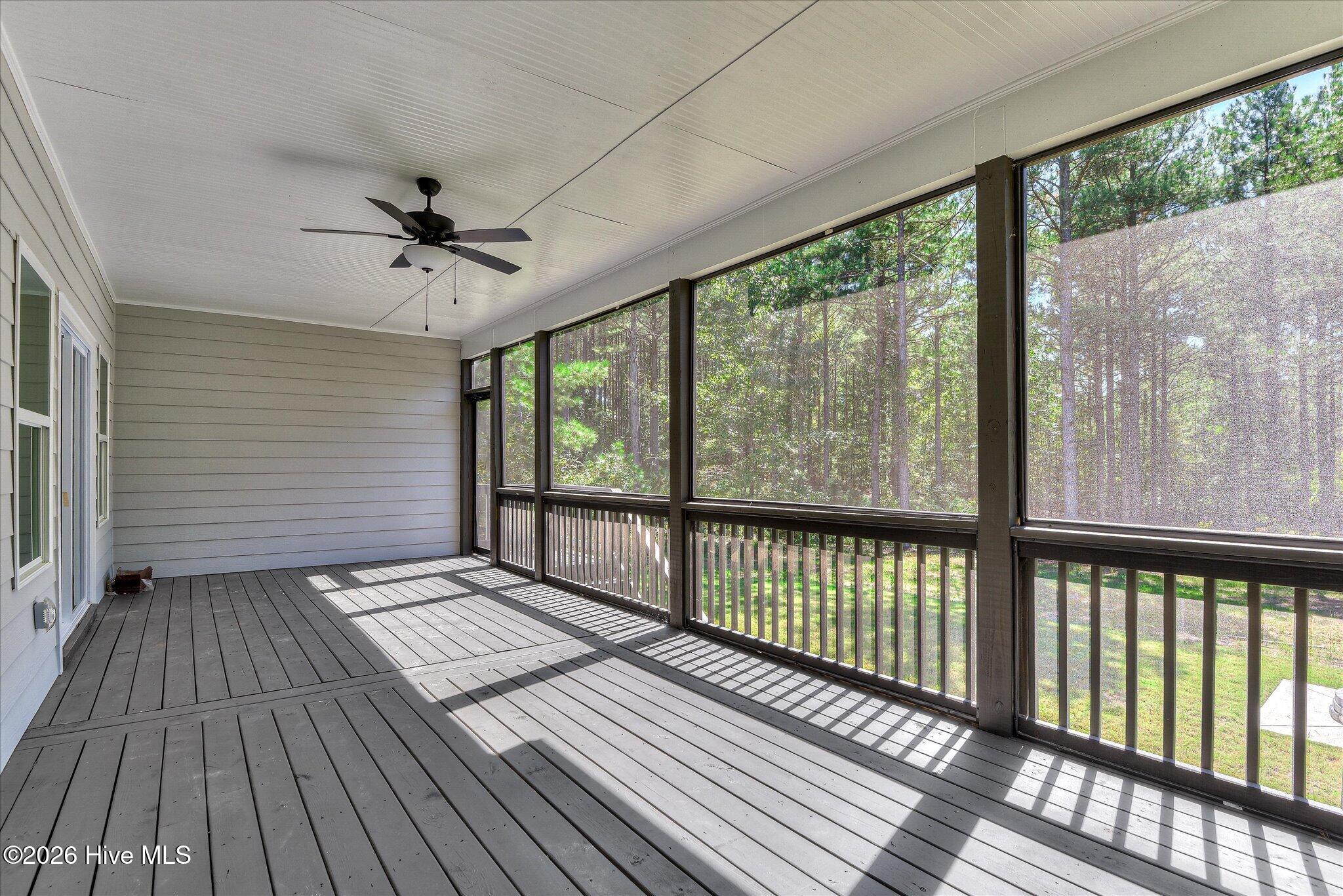 Screened porch stretches across the back of the home.