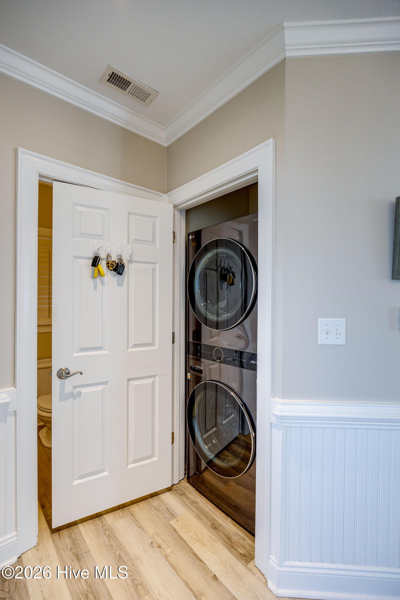 Washer and dryer located near front door.