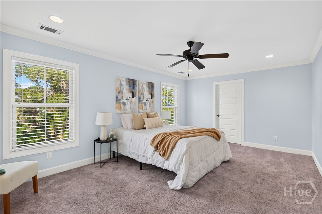 the luxurious primary bedroom has 2 walk in closets