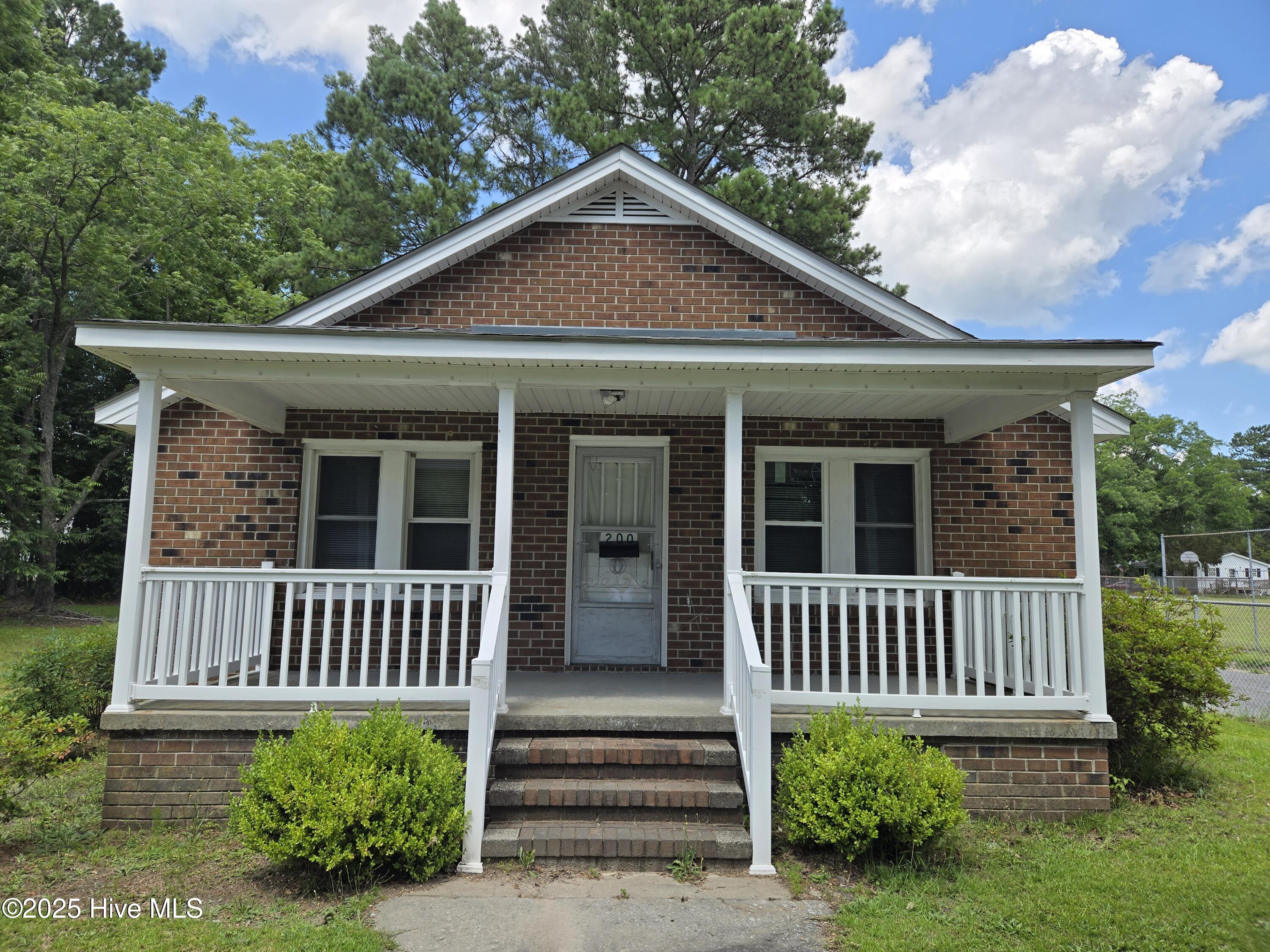 This is a 3 bedroom, 1.5  bath brick house with hardwood floors.  Living room, dining room,  kitchen and utility room   Fenced in yard.  Storage building in the back.