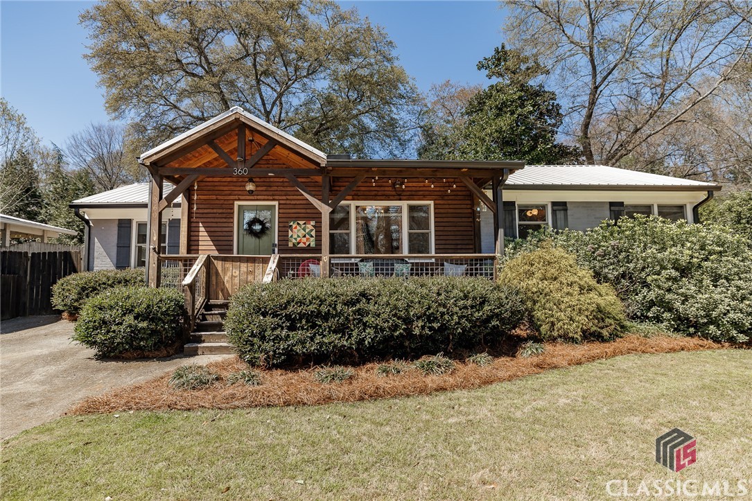 ** BACK ON MARKET DUE TO NO FAULT OF SELLER** Simply stinkin' cute and move-in ready home in Normaltown! While this home has been updated throughout, the charm of yesteryear is apparent from original oak flooring, a telephone nook, to the arched doorways. Spacious kitchen features a herringbone subway tile backsplash, granite counters, stainless steel appliances, and a pot filler over the gas stove. Primary suite features hardwood flooring, vaulted ceiling, a walk-in closet, and recently remodeled bathroom with black and white octagonal tile flooring and tiled shower w/ frameless glass. A split bedroom floorplan allows privacy from guests or rambunctious kids. Two additional bedrooms share an updated hall bathroom, also featuring black and white octagonal tile. The backyard is a gardener's delight with a deck just off the kitchen which leads to a large flagstone patio. Privacy fencing surrounds the entire yard and offers a feeling of seclusion even though the home is in the center of it all! Storage and potting shed is perfect for someone with a green thumb... or we can refer you some excellent landscapers! Overall, the yard is the perfect size and has many mature shrubs and perinnials. Not only is 360 Talmadge Drive located in the heart of Normaltown, but it is also right across from Piedmont Community Park. Enjoy the eateries of the Normaltown Strip or walk Downtown for even more fun. Of note, the UGA Medical School is slated to arrive on the Normaltown Scene at the current Health Sciences Campus. This property is truly adorable and well maintained! xx