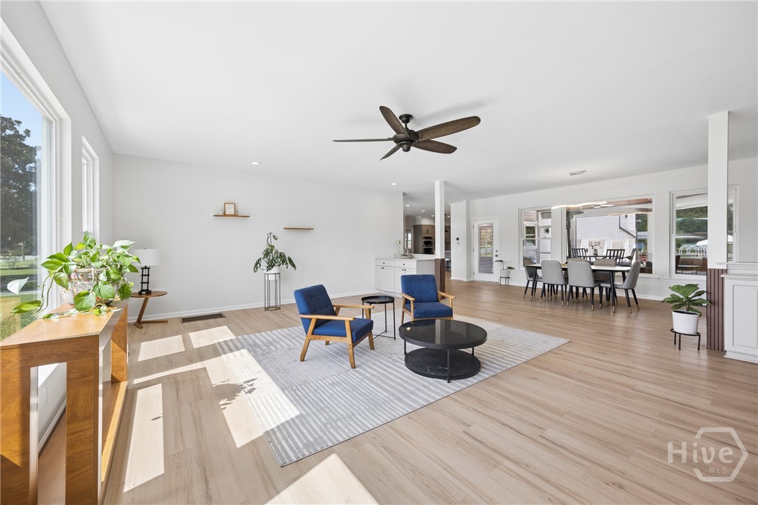 Wide-open, light filled living space. Separated just enough to provide the feels of different spaces, while still collectively being together.