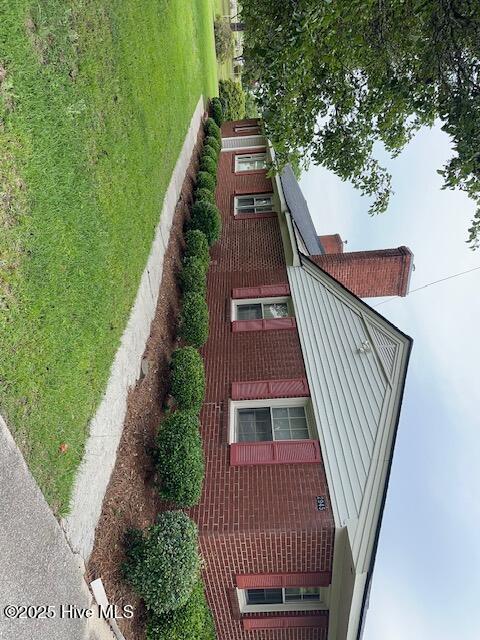Well maintained 3 Br. 2 Ba. Brick Ranch home on .79 of an acre outside the city limits. This charming home has been kept in immaculate condition over the years. There is a nice Formal Living Room with a fireplace, a cozy den with a fireplace, nice kitchen, laundry room/ mud room. The covered back porch looks out over the vast farmland for spending those quiet evenings with family and friends. There is plenty of room for the dogs to roam or the kids to play in the backyard. There are 3 good-sized bedrooms and 2 bathrooms with ceramic tile. The 2-car garage has a work-bench and plenty of room for storage. There are some hardwoods under the carpet in some of the rooms and the heat system uses natural gas.