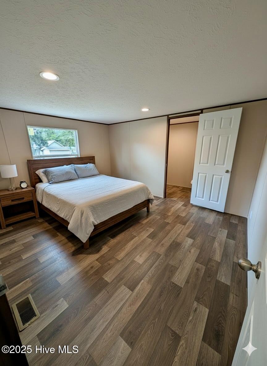 612 Bayshore Drive SE, Bolivia, NC 28422 – photo 10: Owners suite with added AI furniture