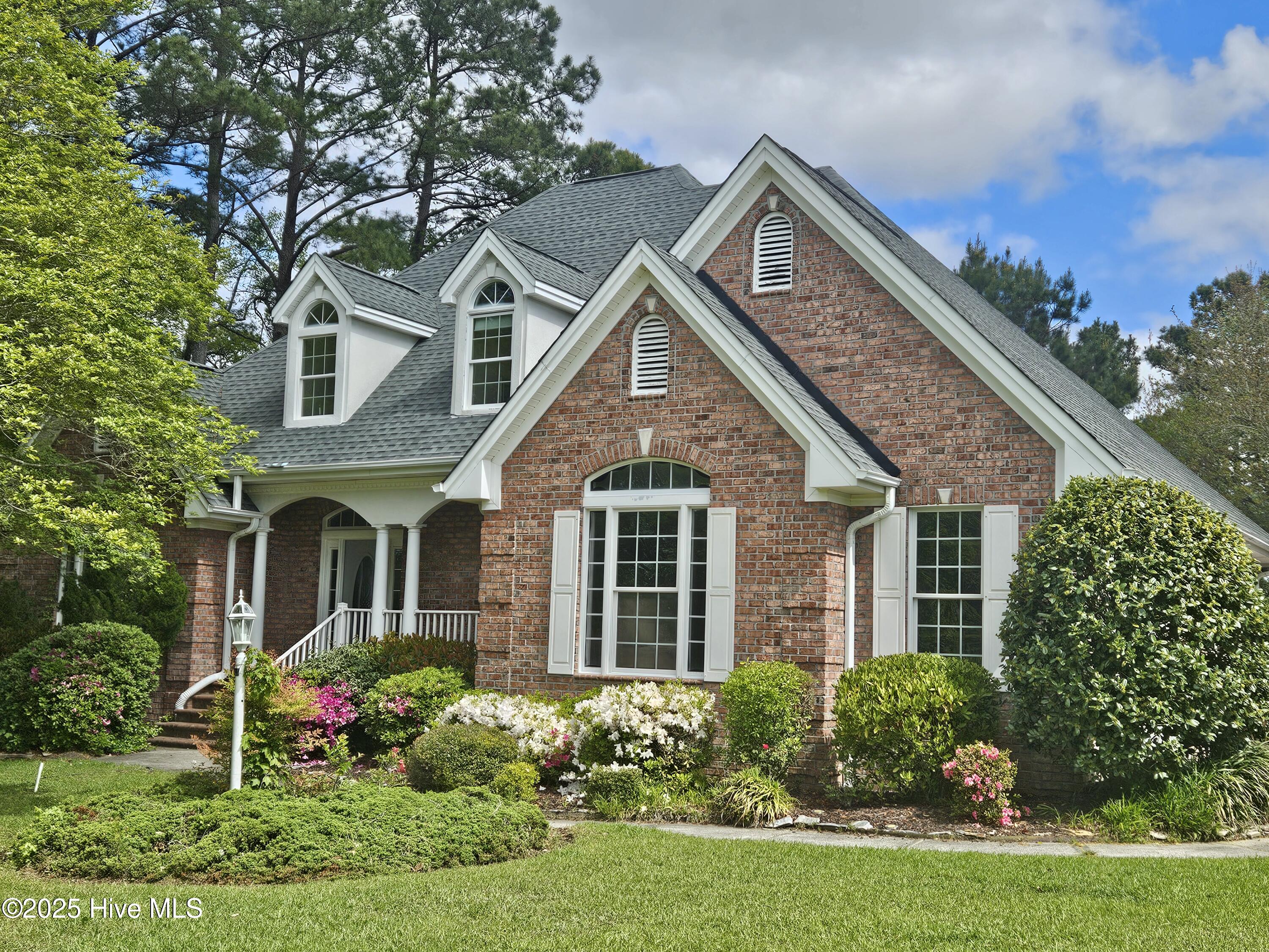 Location, location! This all brick home has 4 BR & 3 BA and located in the prestigious Ocean Ridge Plantation community.  The home has recently been updated almost entirely! All new kitchen with shaker cabinets, new island, granite counters, all LG appliances, new lighting making it very bright.  There's new LVP flooring throughout & all popcorn ceilings have been removed.    Upstairs you have 2 bedrooms that share a large bathroom where  you find new shaker vanities with new granite counters & lights.  The entire interior has been  freshly painted as well.   The Carolina Room has great views of Reflection Pond.  Within the OR community you will enjoy a multitude of amenities.   There are 3 pools, pickleball courts, new amenity center, newly renovated state of the art fitness center, walking/bike paths, community garden, and a beach house overlooking the ocean.  There are over 100+ clubs to draw your attention for enjoyment and making new friends.   This home is waiting for its next family to enjoy for many years to come.