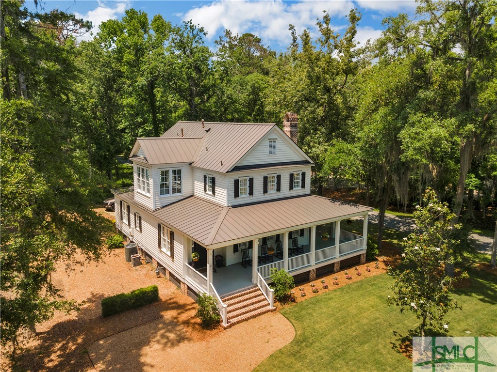 45 Eagles Cove Richmond Hill, Georgia Low Country dream home on the largest lot in the Cherry Hill section of The Ford! This spacious residence exudes comfort and sophistication. Natural light floods the interior and the open concept living area is ideal for hosting gatherings. Newly renovated chef-inspired kitchen boasts a Viking double oven, six-burner gas cooktop, wine cooler, and stem glass dishwasher. Master retreat on main. Two generous ensuite bedrooms on the second floor plus a separate library/office that can easily be converted into a fourth bedroom. Enjoy the outdoors from the generous porch areas, whether you prefer an open-air ambiance or the tranquility of a screened-in space. With impeccable condition and recent upgrades including a 4-ton A/C unit, landscaping, drainage system, and fresh paint, this home is turnkey. Don't miss the chance to experience The Ford Field and River Club at its finest. Membership is required. Schedule a private tour today and make this exquisite Cherry Hill residence your own!
