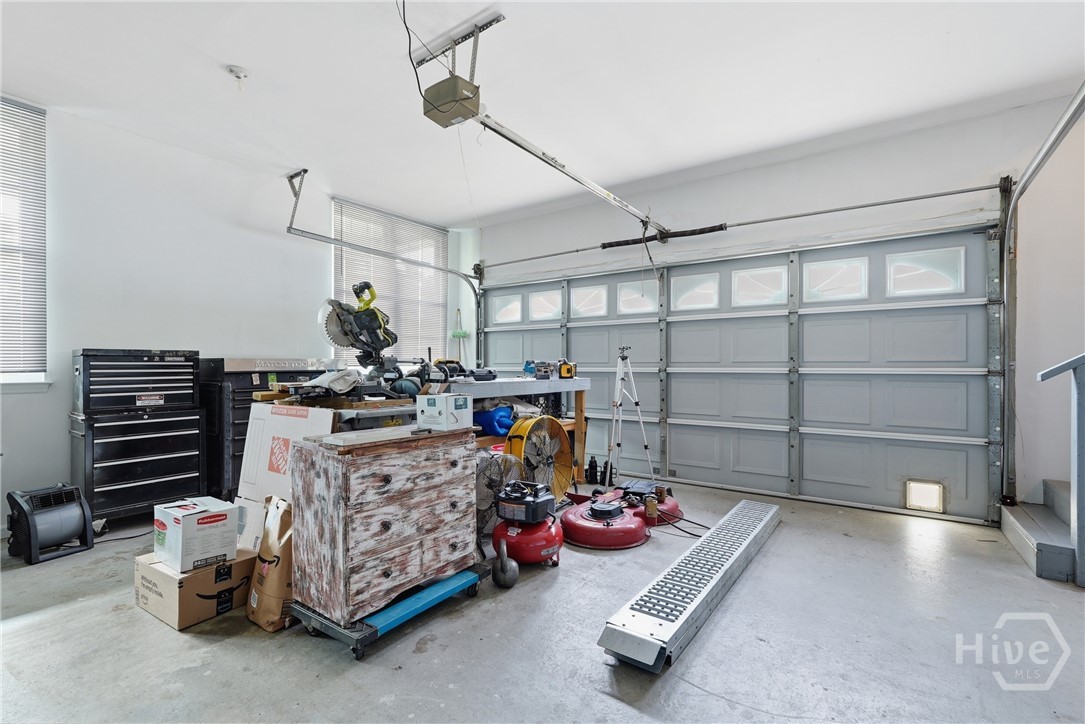 The 2-car garage features under stairwell storage