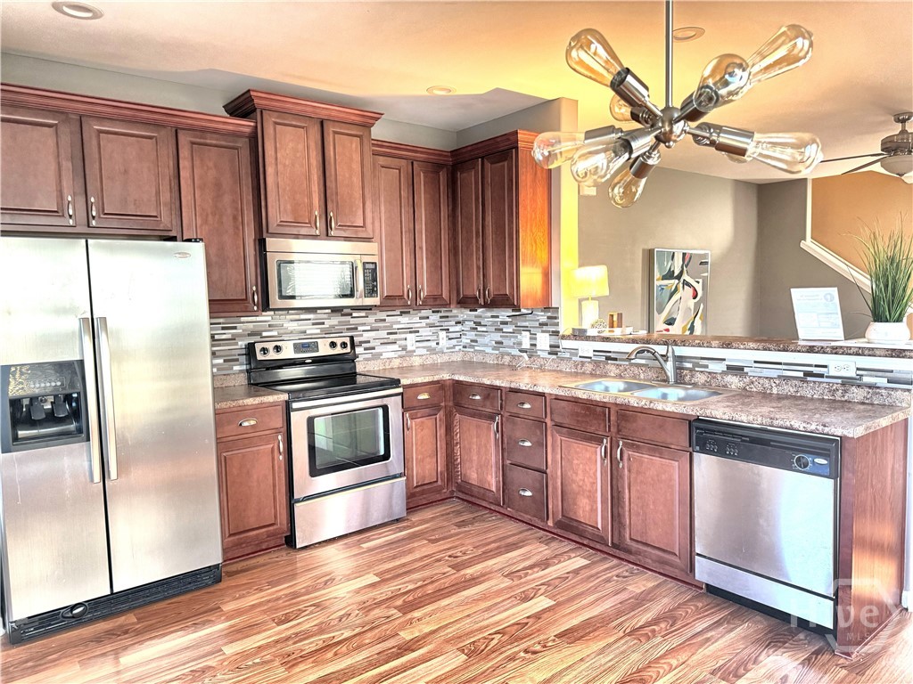 Open Kitchen with Stainless Appliances