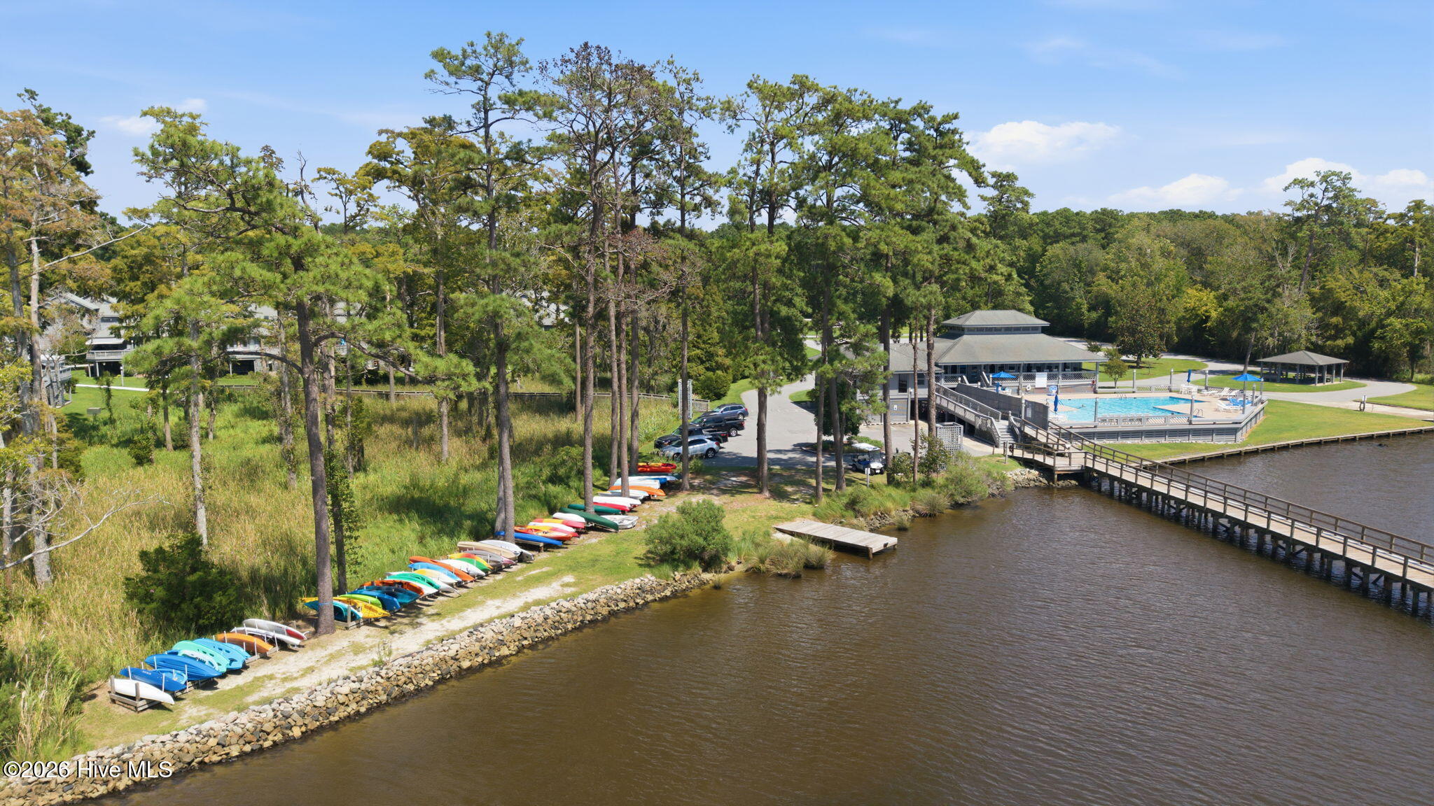 VIEW OF CLUBHOUSE, POOL AND DOCK