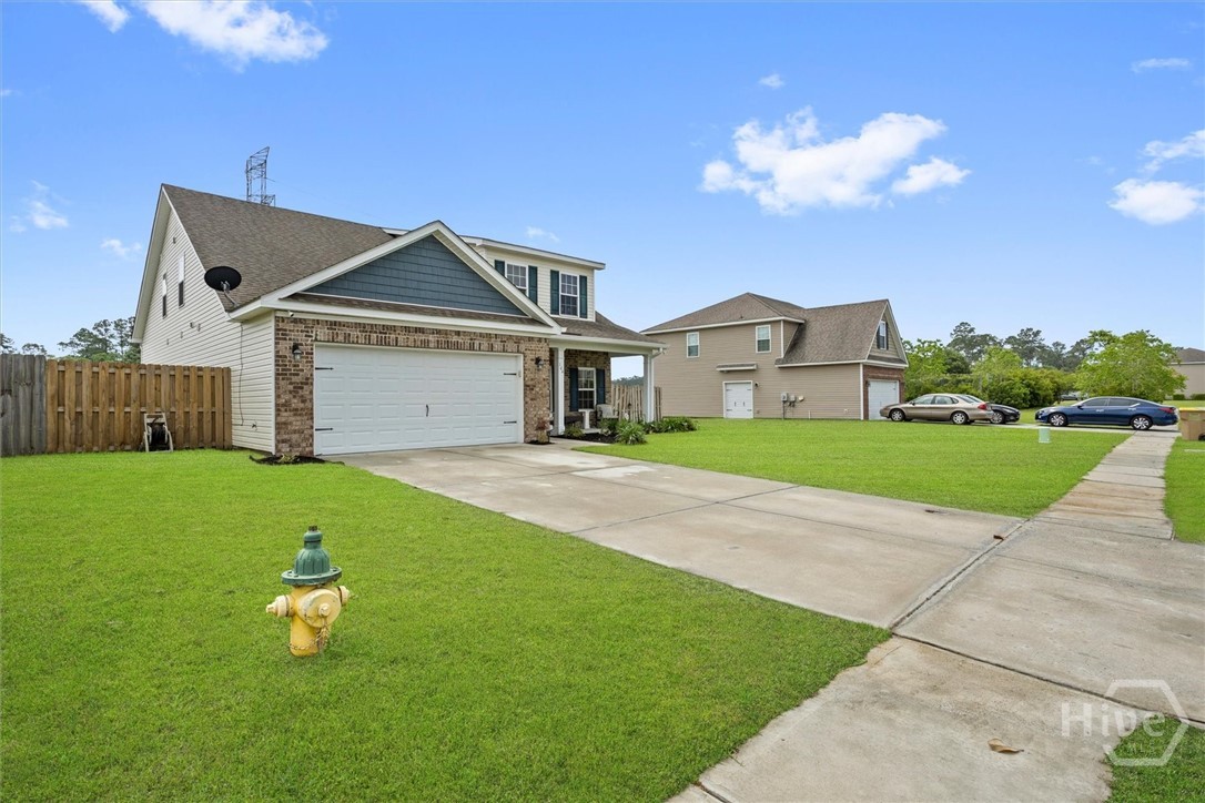 Come secure your new beautiful 4 bedroom South Effingham home! It comes with a spacious downstairs primary suite with custom walk-in closets, dual vanity, garden tub and separate walk-in shower. Enjoy the many details in this home such as hand scraped wood and tile flooring. A generous great room and dining room, with suitable space for stylish furniture. The kitchen is open and designed with plenty cabinet space, granite countertops, island and stainless steel appliances. Come home to a fully landscaped front yard maintained with irrigation. The home offers energy efficiency with spray foam insulation in the attic. A relaxing set environment with a screened in back patio that overlooks a large backyard. This home is conveniently located to many nearby amenities, schedule your showing TODAY!!!