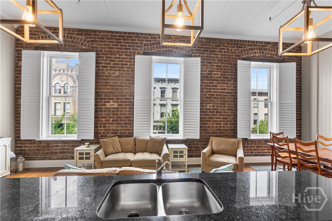 Exposed brick walls and abundant windows.