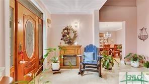 The beautiful wood front door leads you into a spa