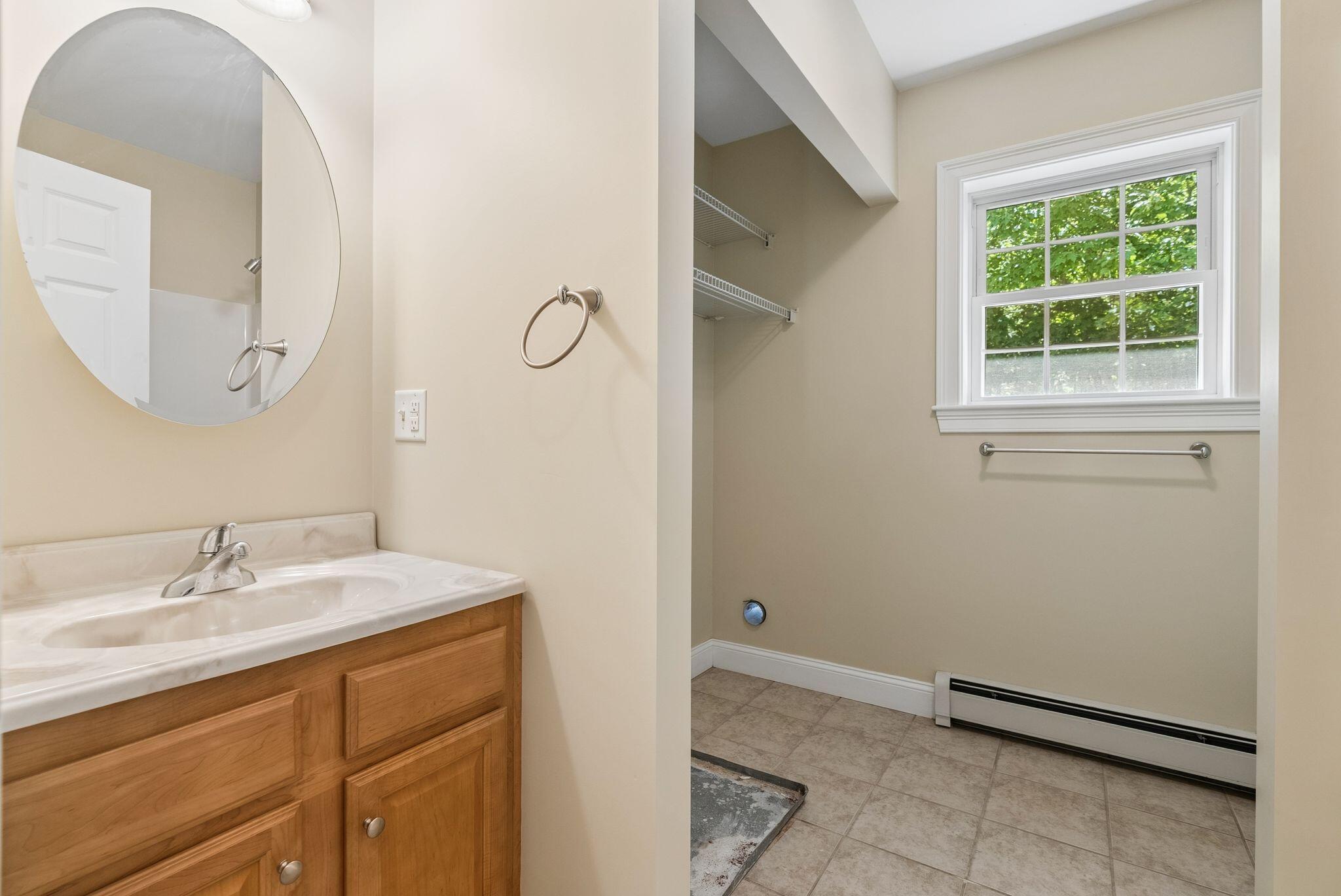 Additional full bathroom with laundry on second floor