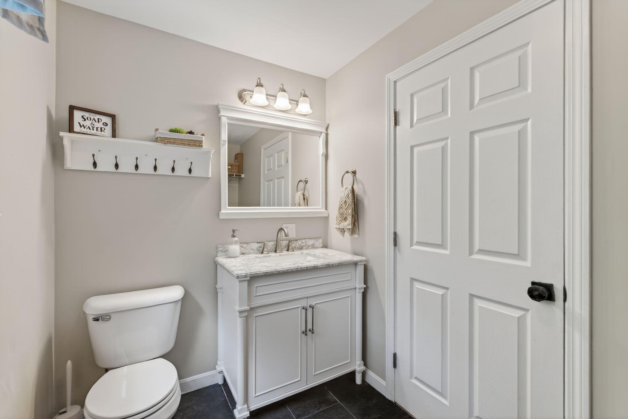 1/2 bathroom on first floor with washer and dryer hookup