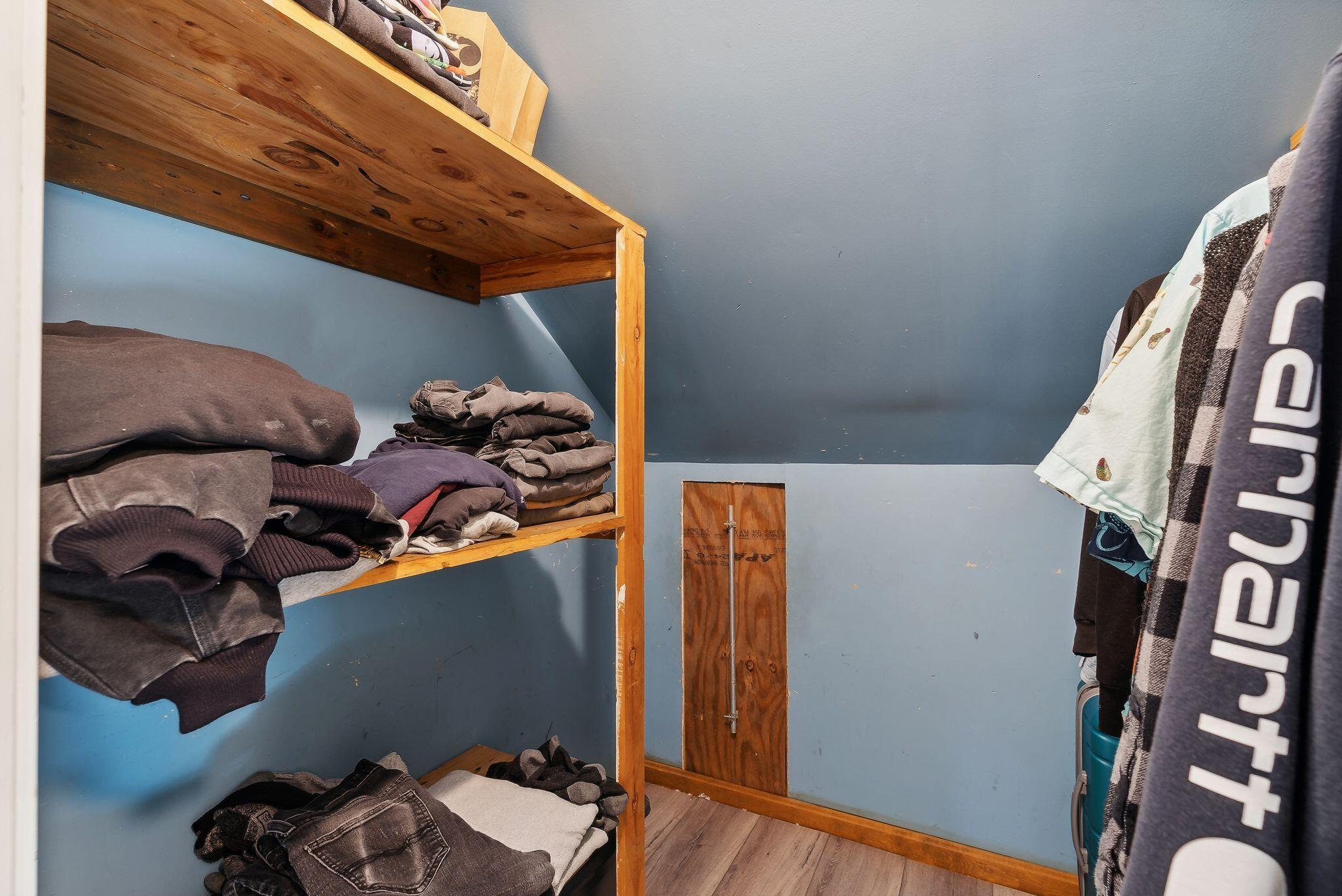 Walk in closet at the top of the stairs