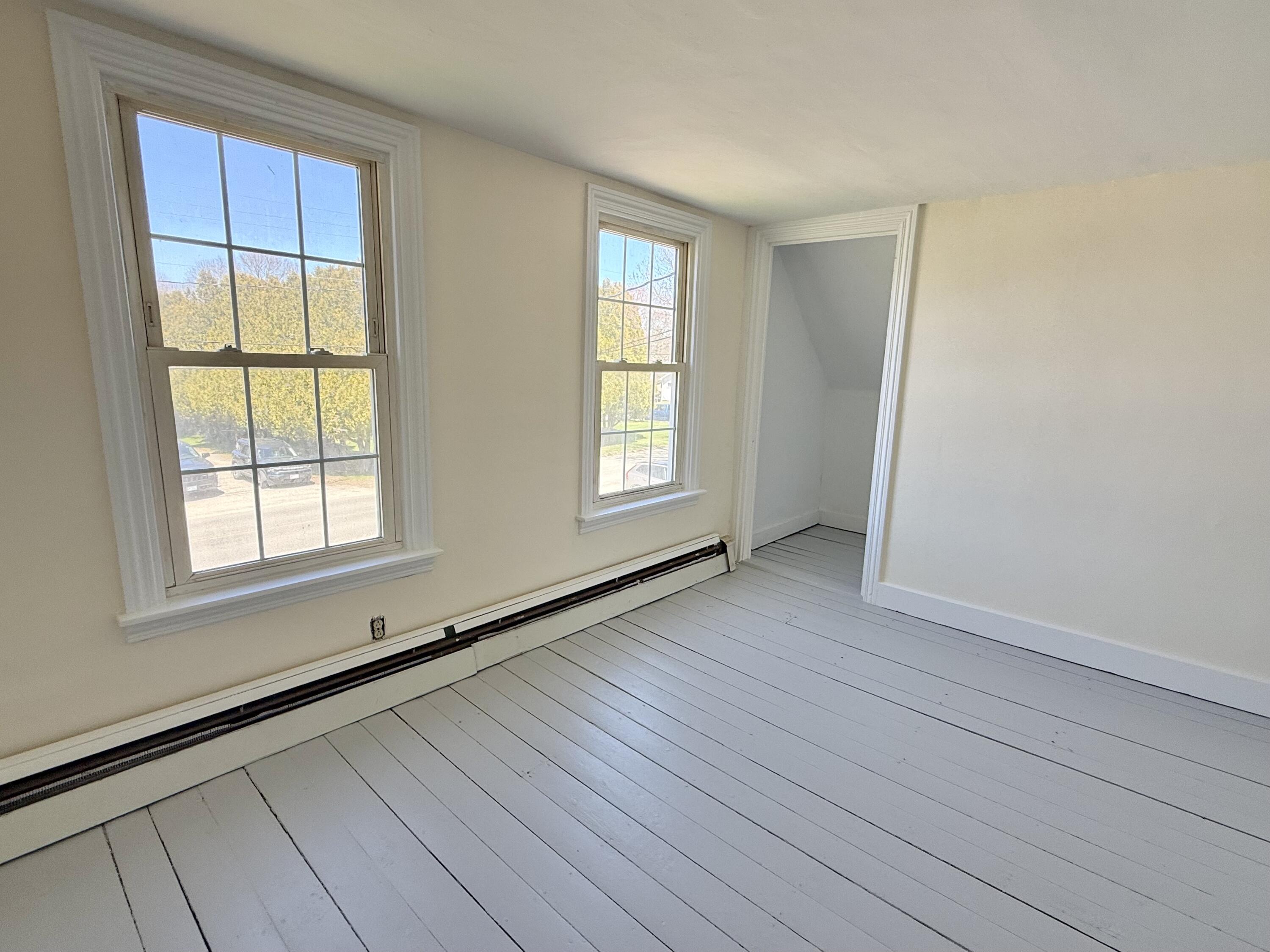 Two thermopane windows in primary overlooking the yard and E. Main Street.