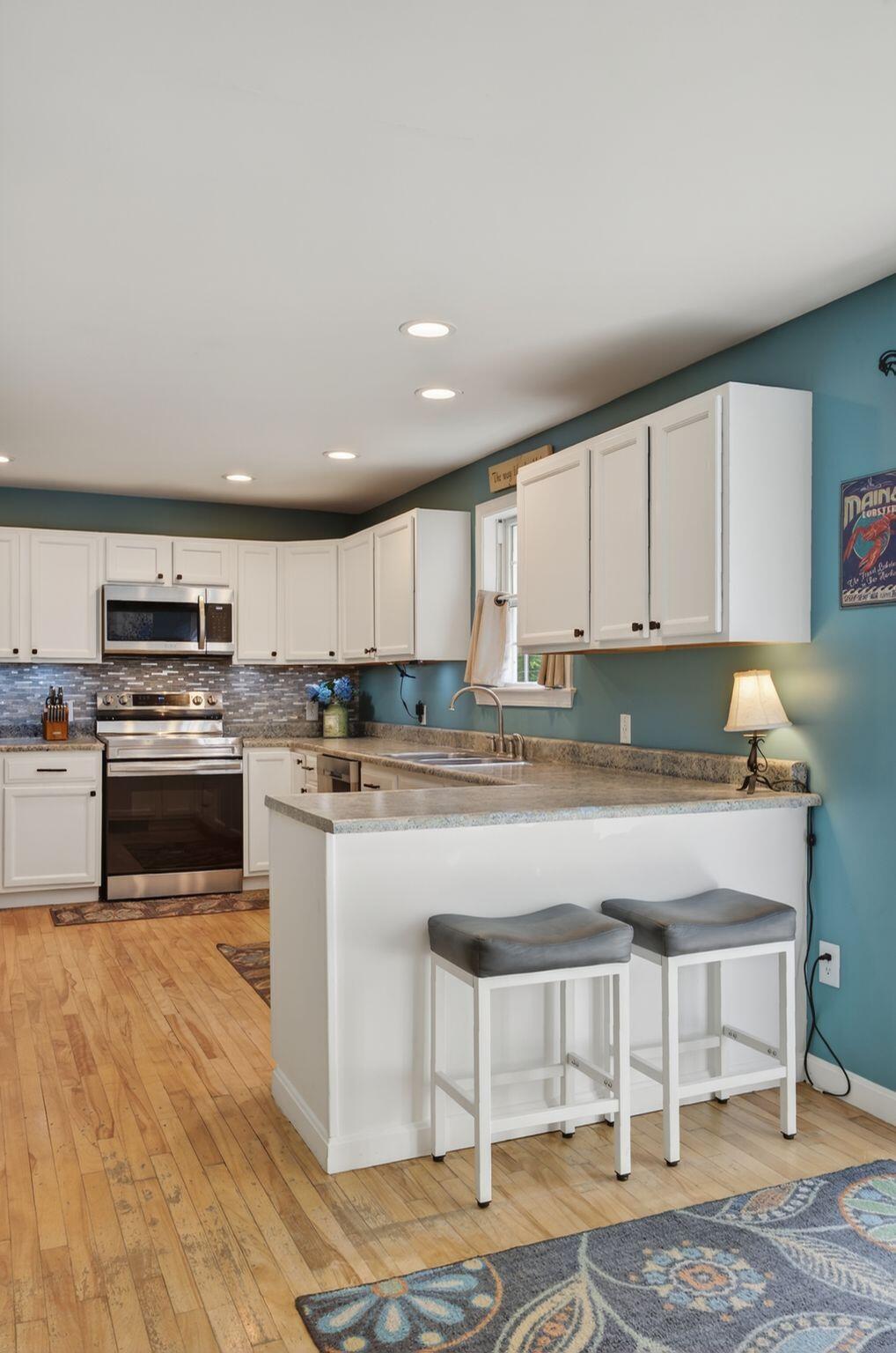 Kitchen with walk in pantry and access to backyard deck