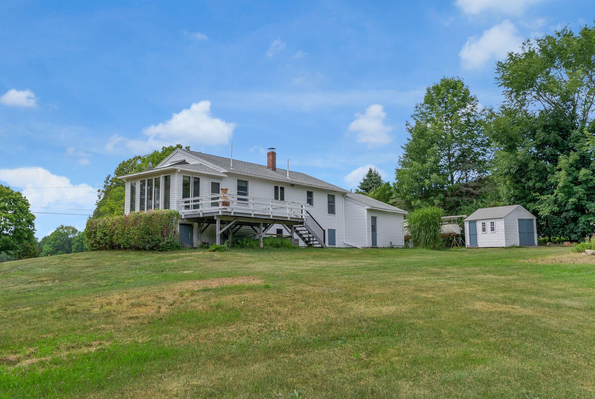 155 Ridge Road, Lisbon, ME 04252 The large level yard provides plenty of room for all sorts of outdoor activities.