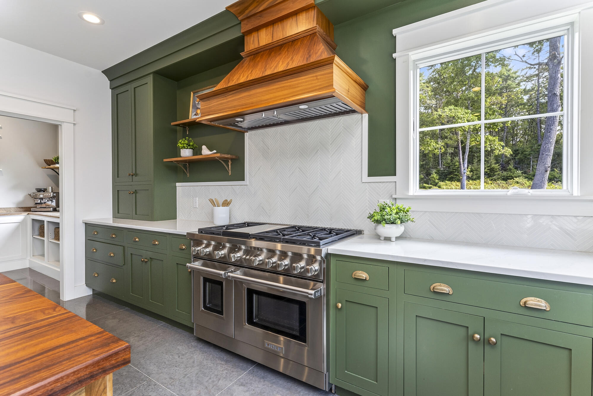 48" Wolf range and walnut vent hood