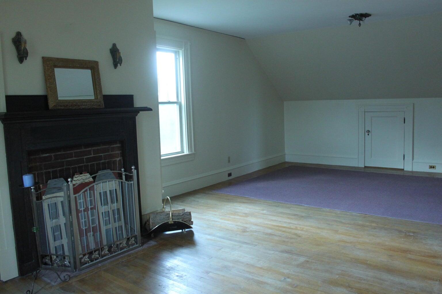 3rd floor living room with working fireplace