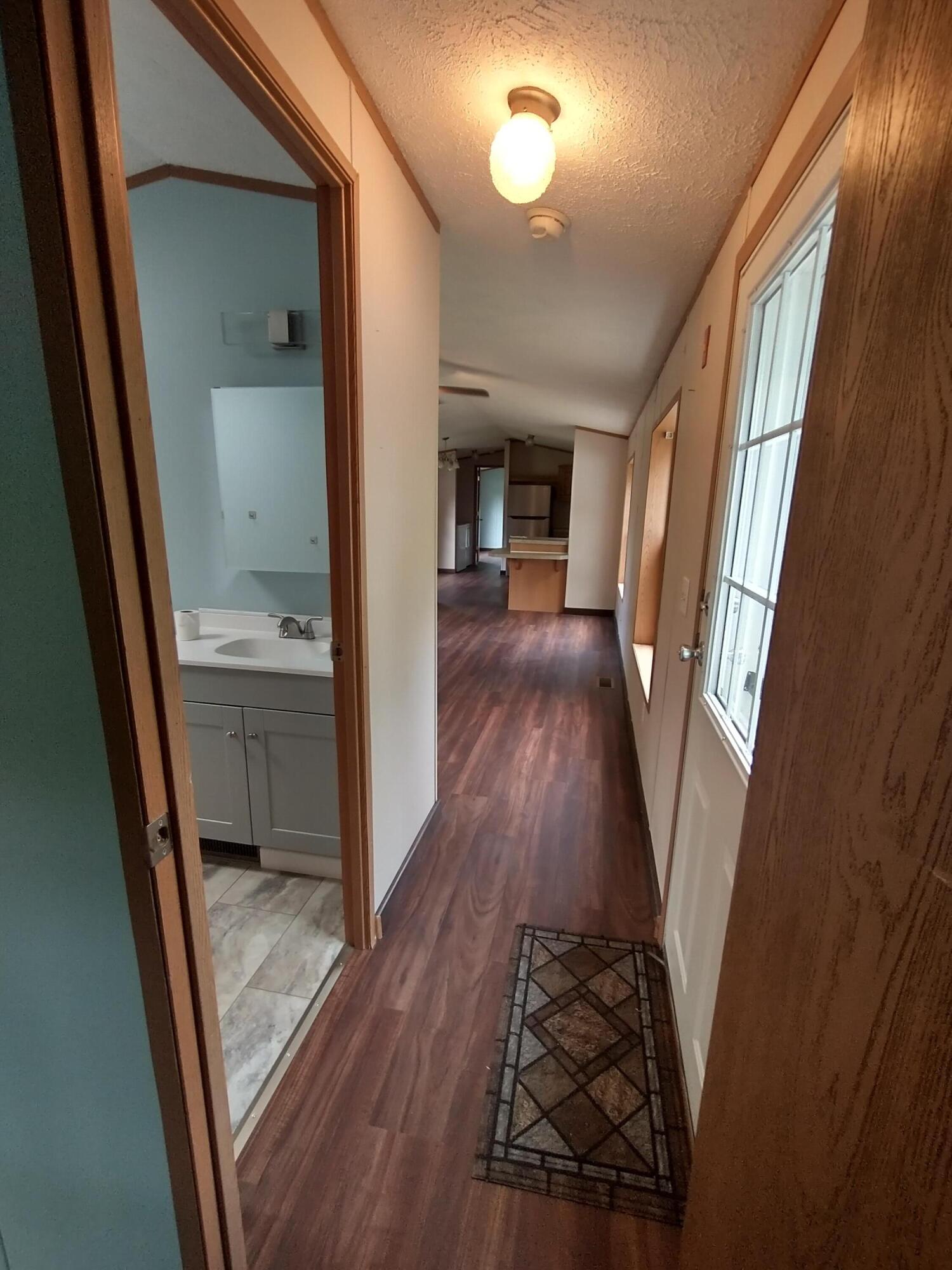 57 Carter Woods, Bradley, ME 04411 View down hall from 2nd Bedroom