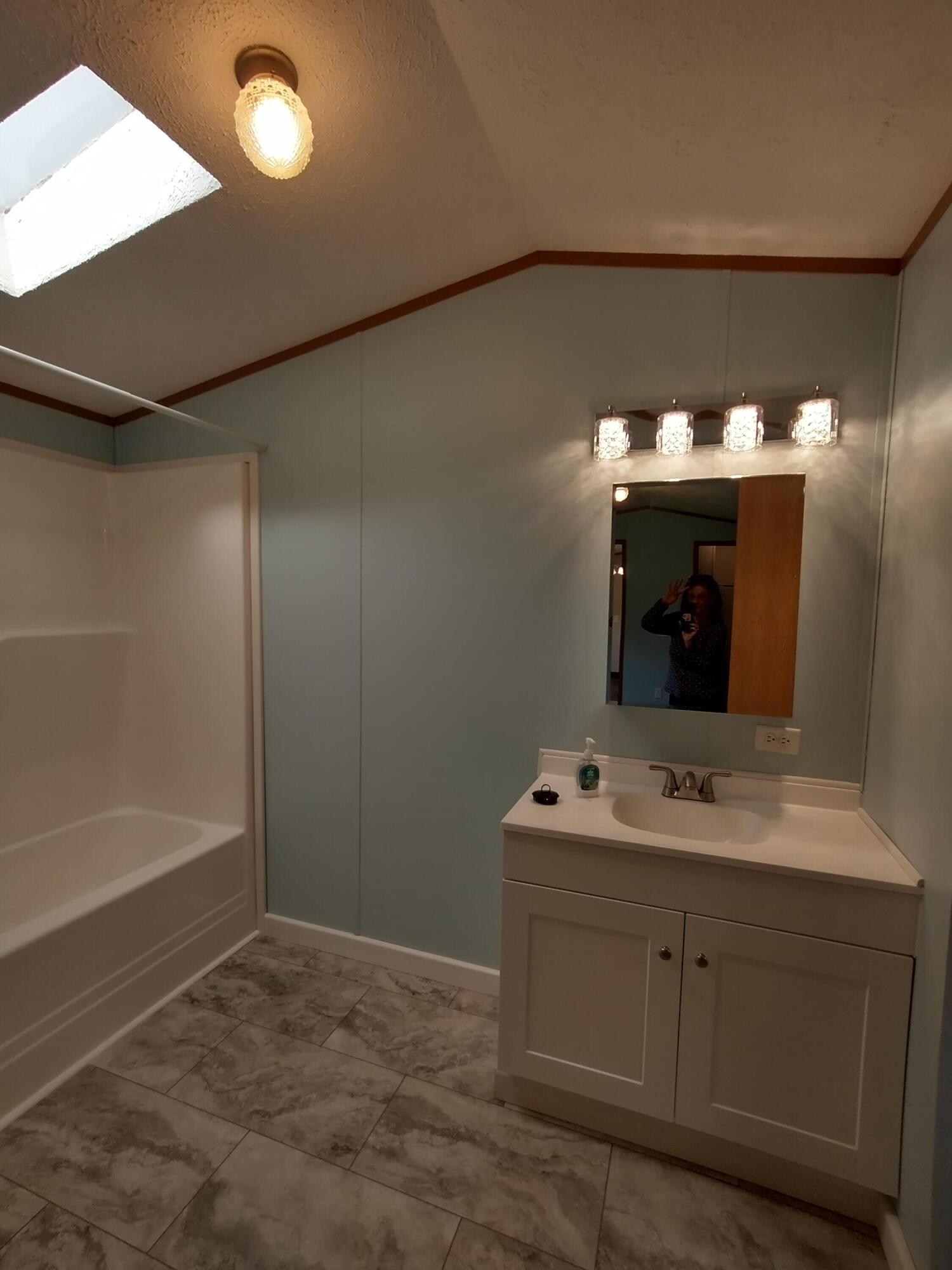 57 Carter Woods, Bradley, ME 04411 Primary Bedroom Bath with skylight