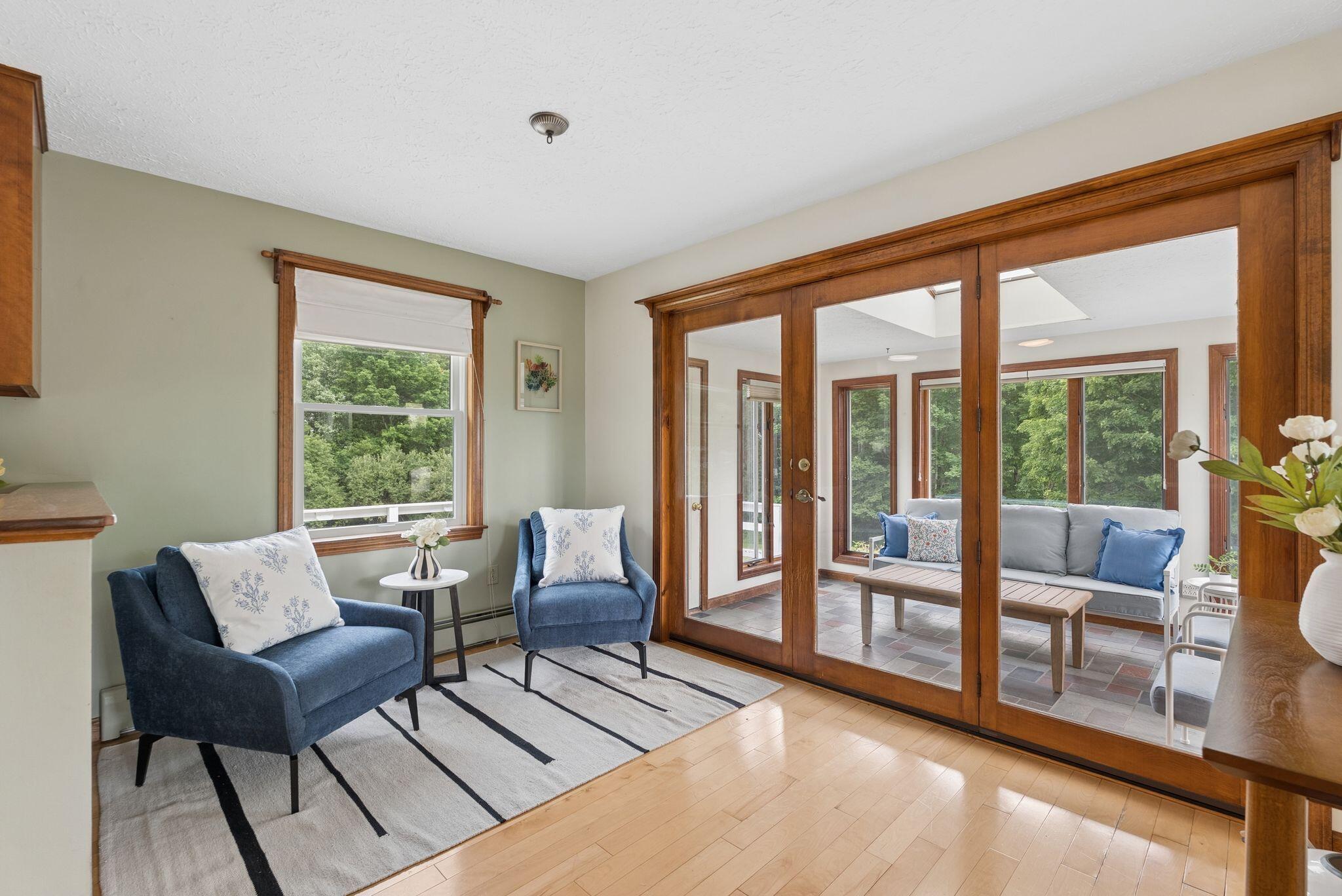 155 Ridge Road, Lisbon, ME 04252 The kitchen and sitting area open up to the gorgeous glassed in porch.