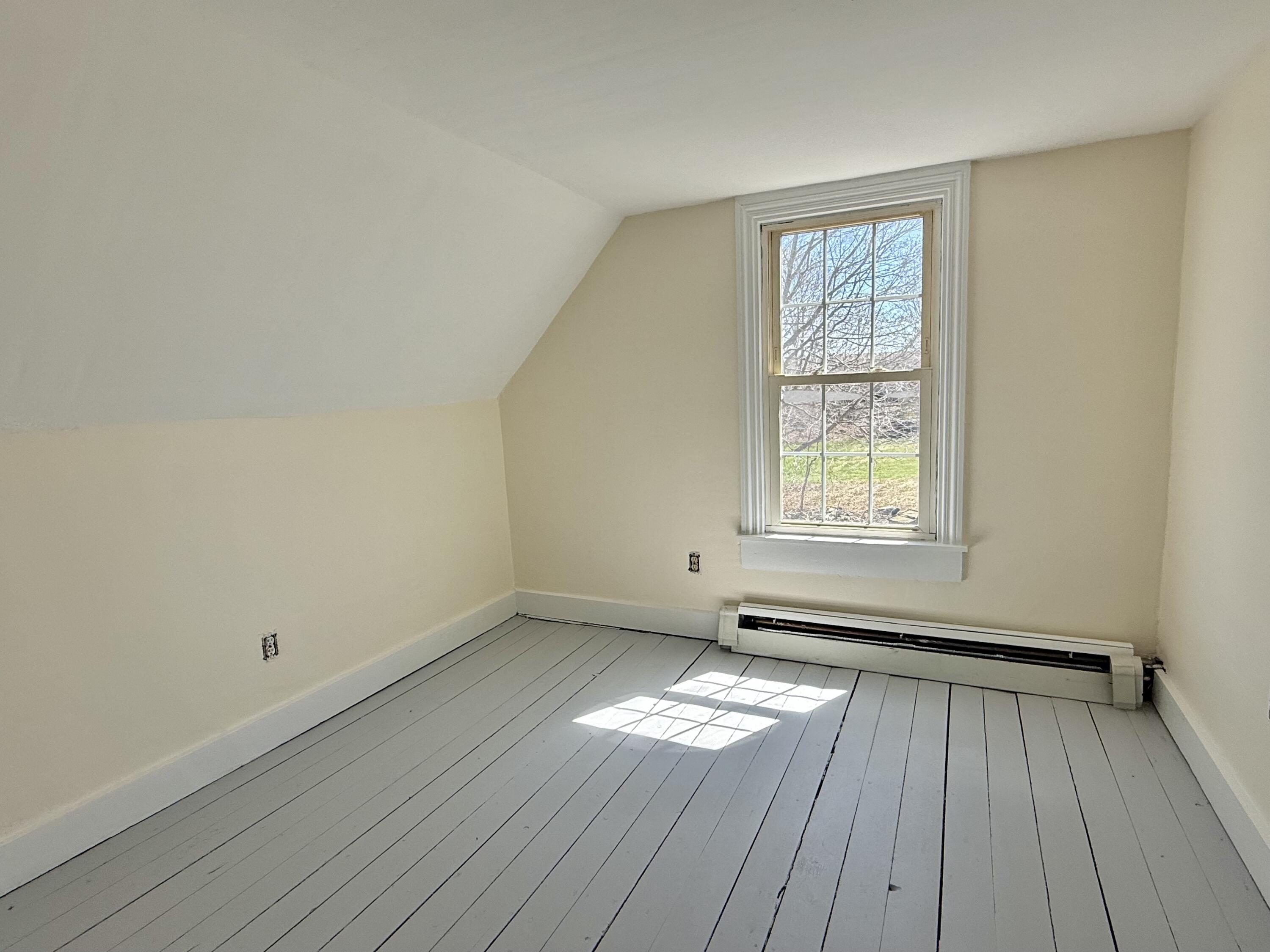 9.6'X9' Guest bedroom is on the south side of the house and has freshly painted floors and walls.