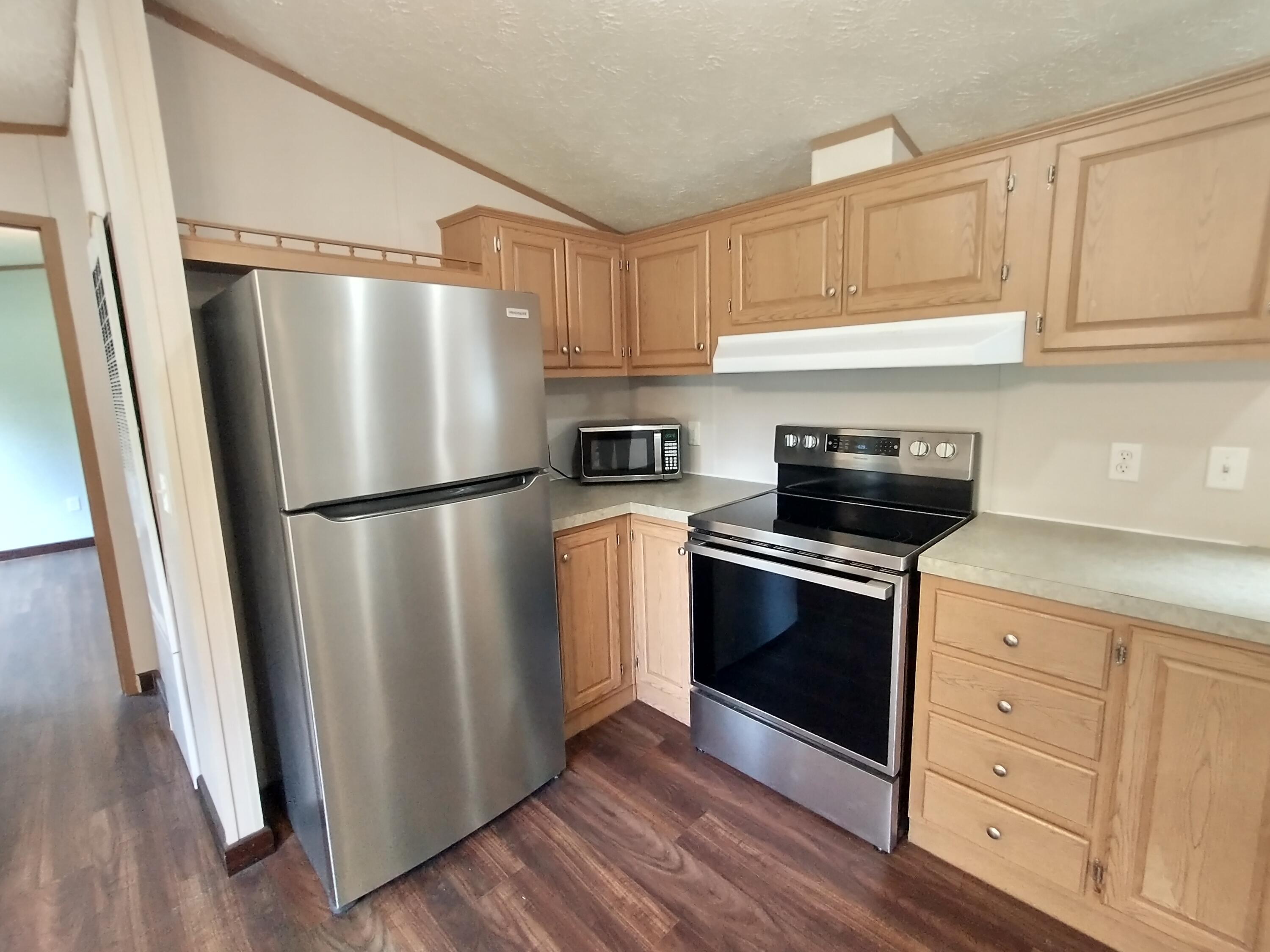 57 Carter Woods, Bradley, ME 04411 Kitchen with nearby laundry room