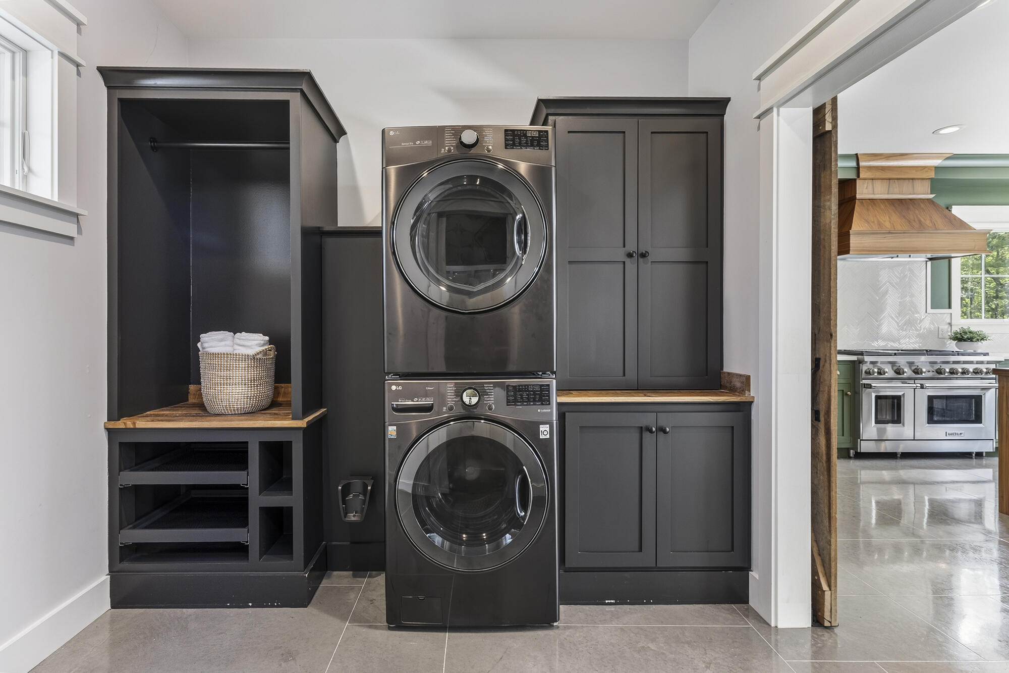Convenient first-floor laundry with built-in cabinets and drying racks