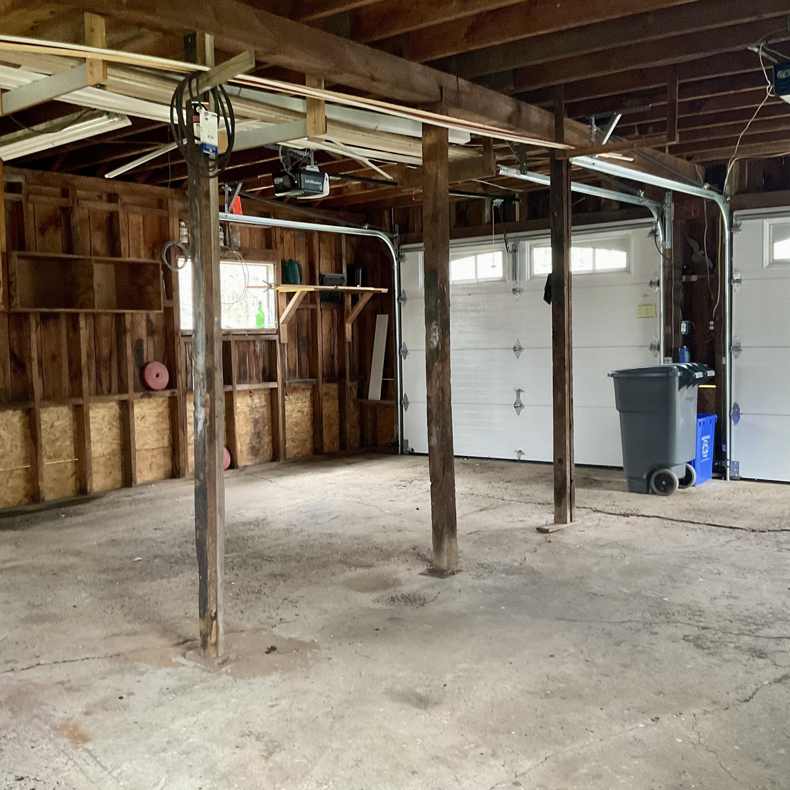 GARAGE HAS LONG WORKBENCH; OVERSIZED AND HAS STAIRWAY TO LOFT ABOVE