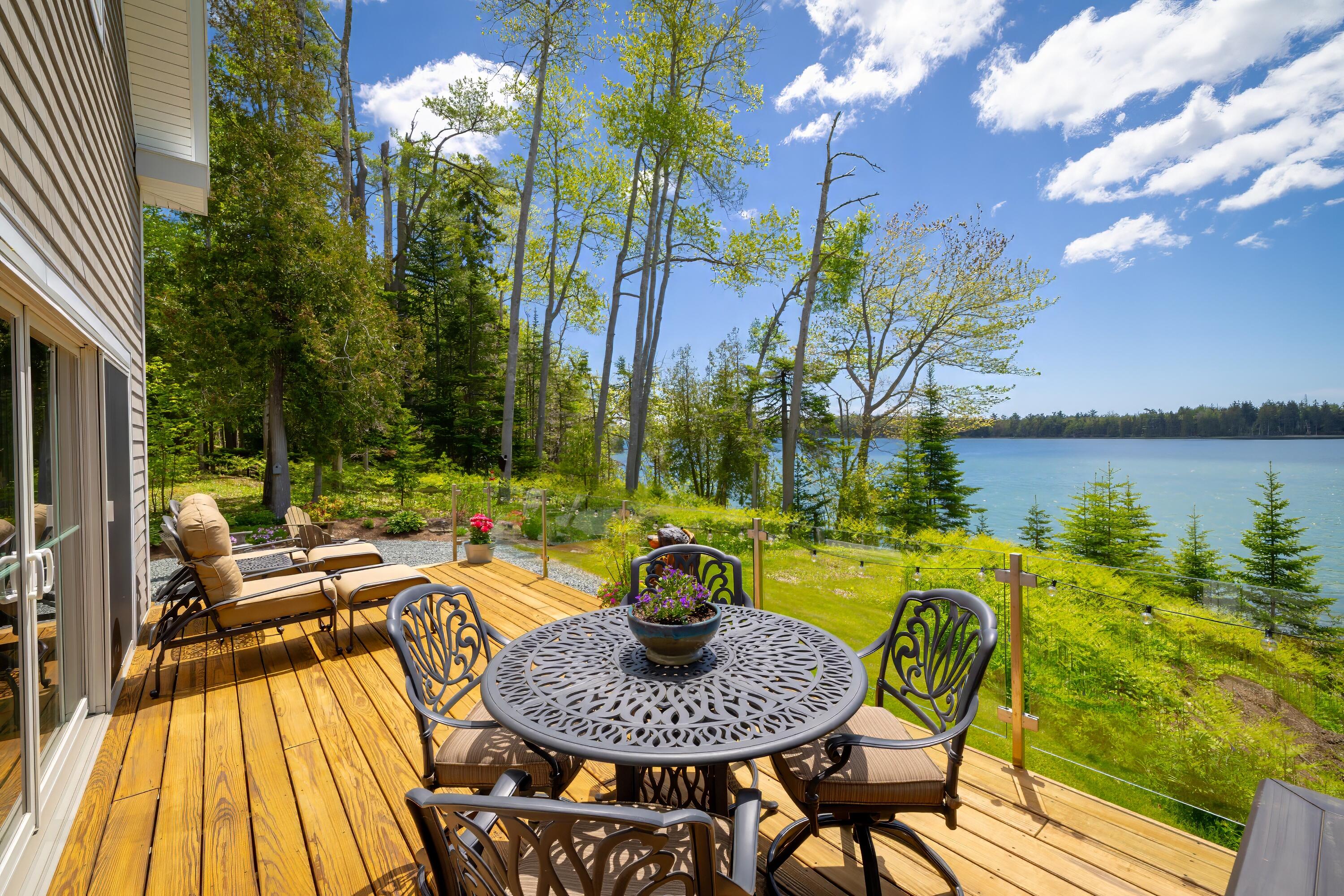Deck with a view with glass railings.