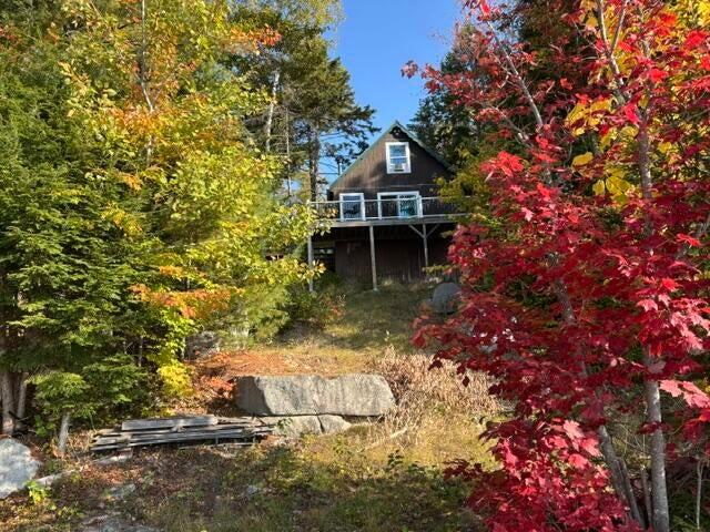 515 Rock Ridge Rd,Fire Road 17 Road, T1 R9 Wels, ME 04462 front of camp