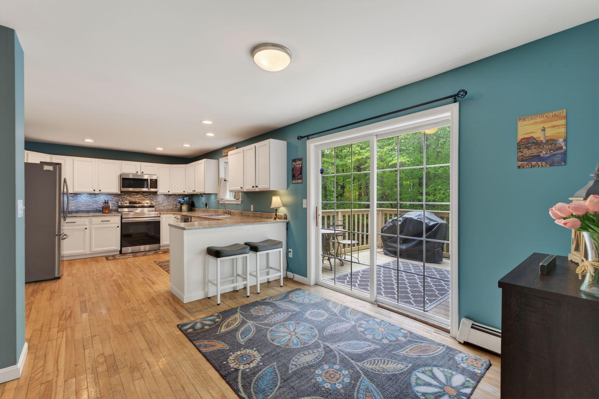 Kitchen with walk in pantry and access to backyard deck