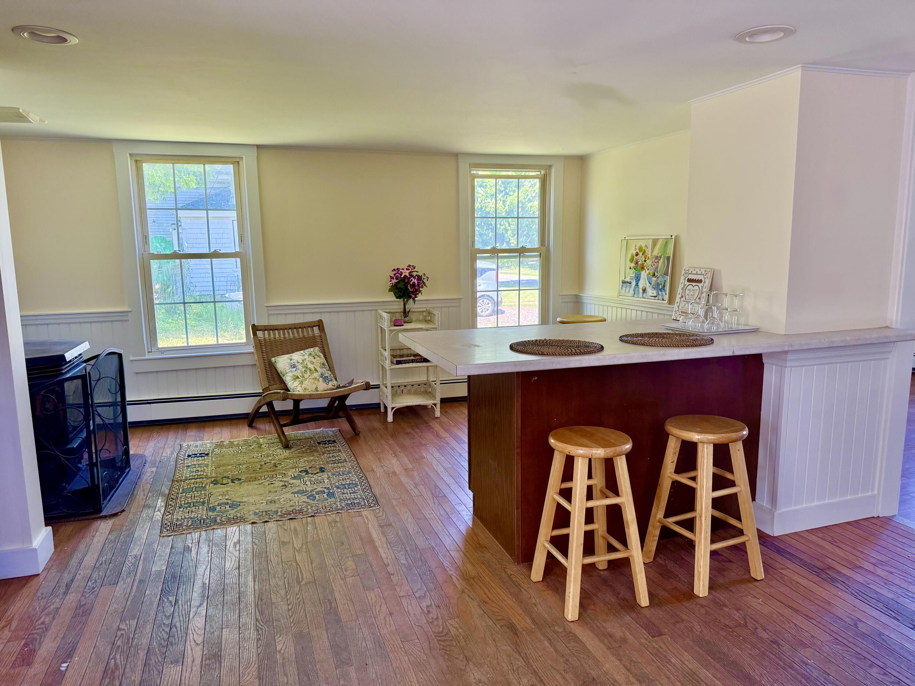 Freshly painted interior of this classic New Englander near the school and village area. Featured here is the eat-in kitchen with pellet stove sitting area
