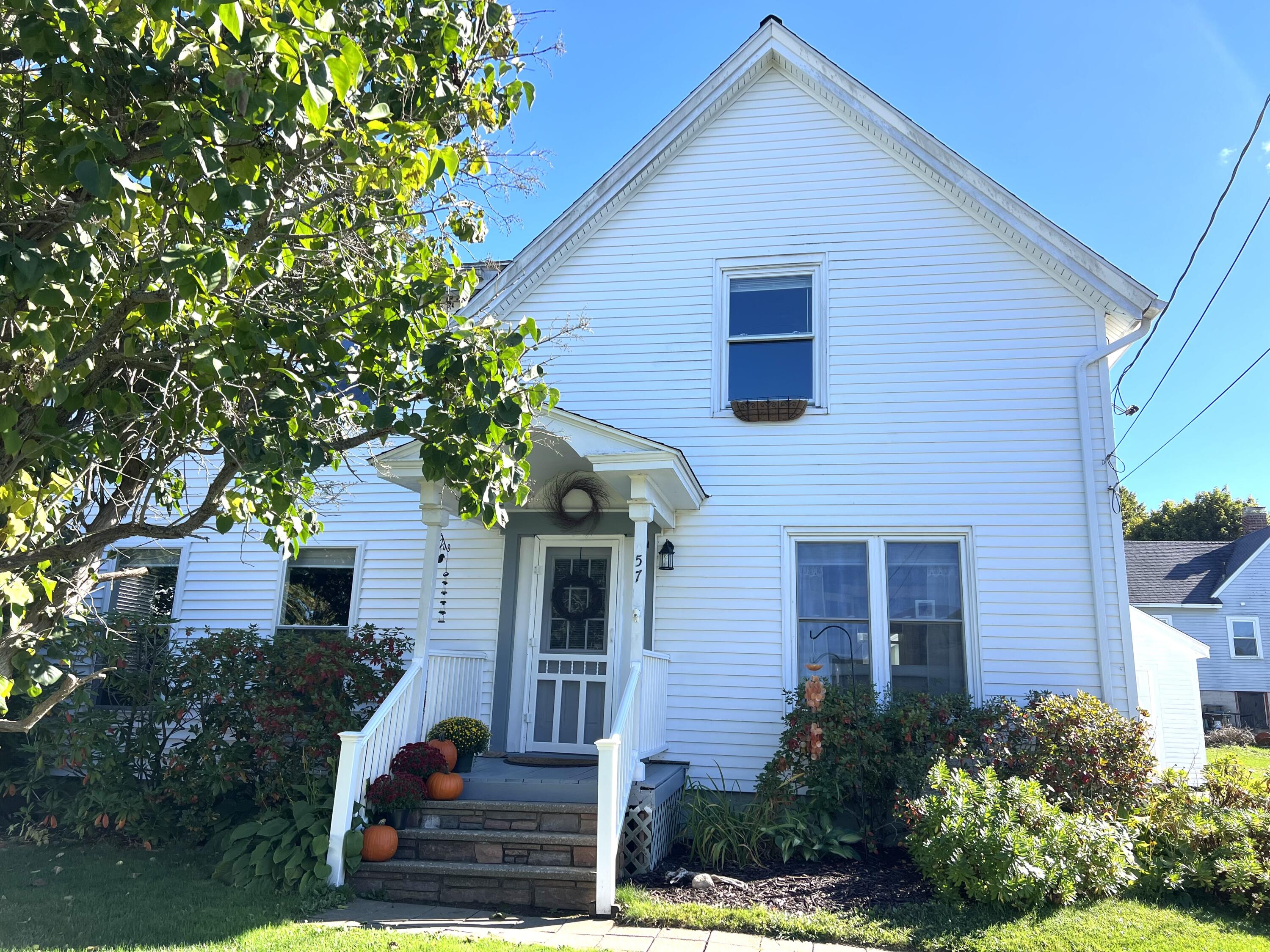 Charming antique home is situated in the highly desireable South End and is just steps to Sandy Beach. MOTIVATED SELLERS ARE OFFERING CONCESSIONS AT CLOSING. Classic features are preserved including wood floors, French doors from living room to office, and a central dining room with built-ins.   There's an additional first floor room that could be a first floor bedroom, playroom or studio with toasty, radiant heated flooring. Upstairs there are three bedrooms and a bonus space leading to the back stairs. The upstairs bathroom includes the  washer and dryer, conveniently located in near the bedrooms. There is new carpet in the master bedroom, hallway and bonus space. The back staircase leads to the kitchen and fenced in backyard, with a deck that catches the afternoon sun. The one car garage is generously sized, including a work area and a large storage loft accessible by a rear staircase.  New heating system and fuel tank in the basement, with built a storage space.     Rockland offers a rich community culture including: art galleries, museums, yoga studios, gyms, book stores, cafe's, restaurants, shops and the Strand Theater. The boardwalk to town is just steps away and is the preferred walking route, connecting you on foot to all the downtown amenities as well as miles of sidewalks and walking trails.  The Midcoast's own airport is nearby in Owls Head and it's  just 1.5 hours to the Portland Jetport. The public landing is accessible for kayaking, sailing, boating. The ferry terminal provides island access year round for exploring the outer islands. Hiking and recreational areas surround Rockland for biking, hiking, skiing, skating, snowmobiling and more throughout the year.   MOTIVATED SELLERS ARE OFFERING CONCESSIONS AT CLOSING and connection to a lender who gives a one-point credit on mortgage rates. This option, combined with seller's generous contribution at closing, significantly improves affordability of this charming Sout End property.