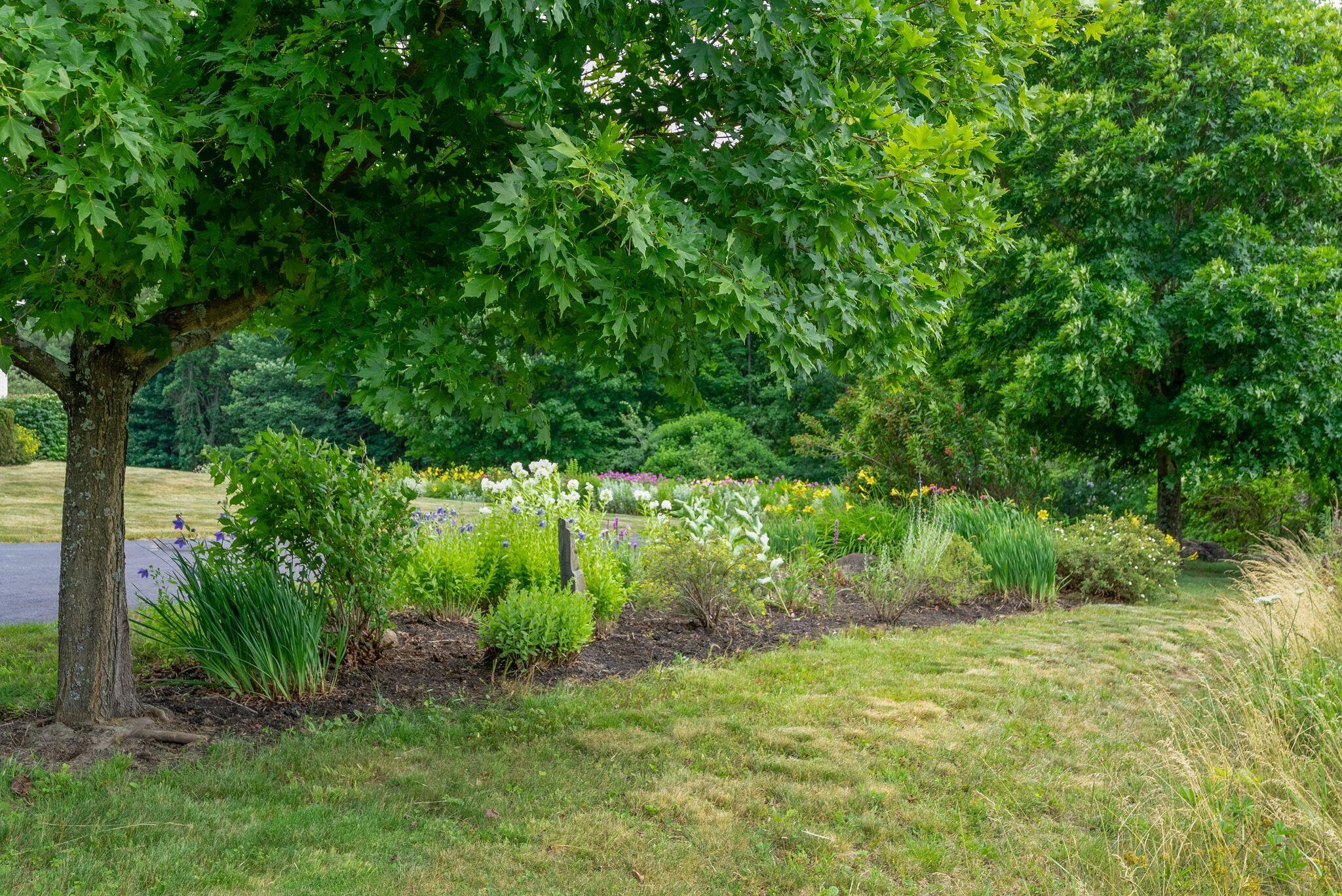 155 Ridge Road, Lisbon, ME 04252 The property features stunning perennial gardens and fruit trees!