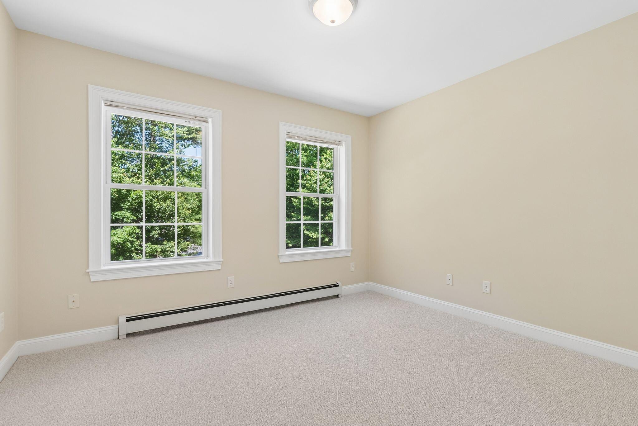 Second bedroom with large windows