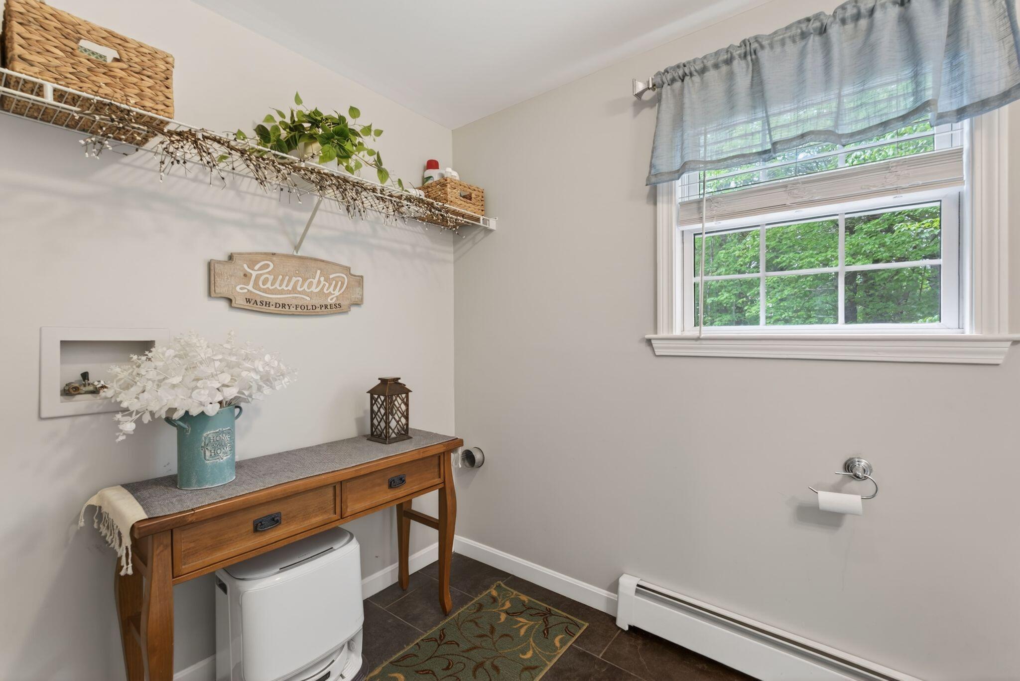 1/2 bathroom on first floor with washer and dryer hookup