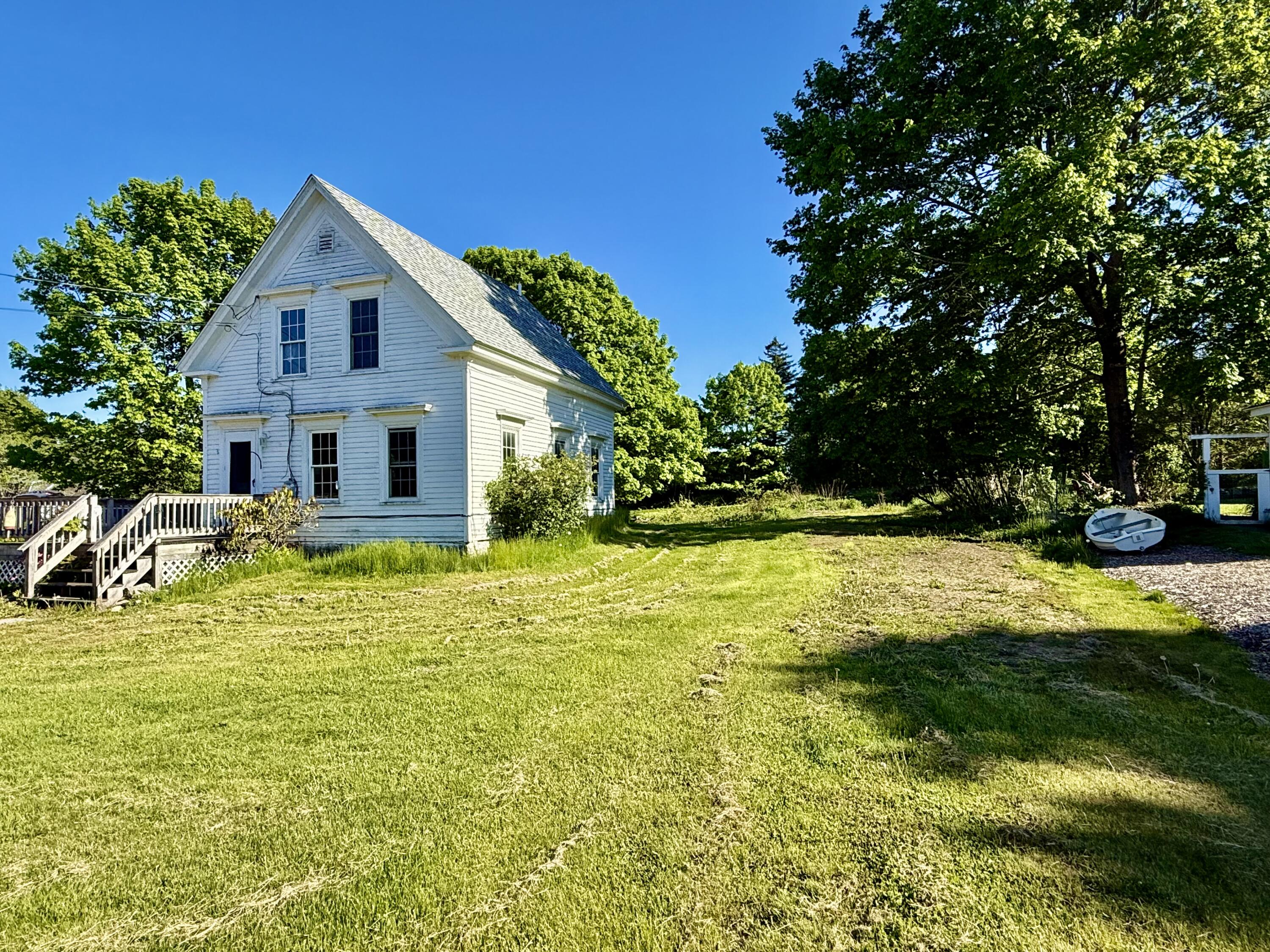 Spacious side yard for family games and gardening.