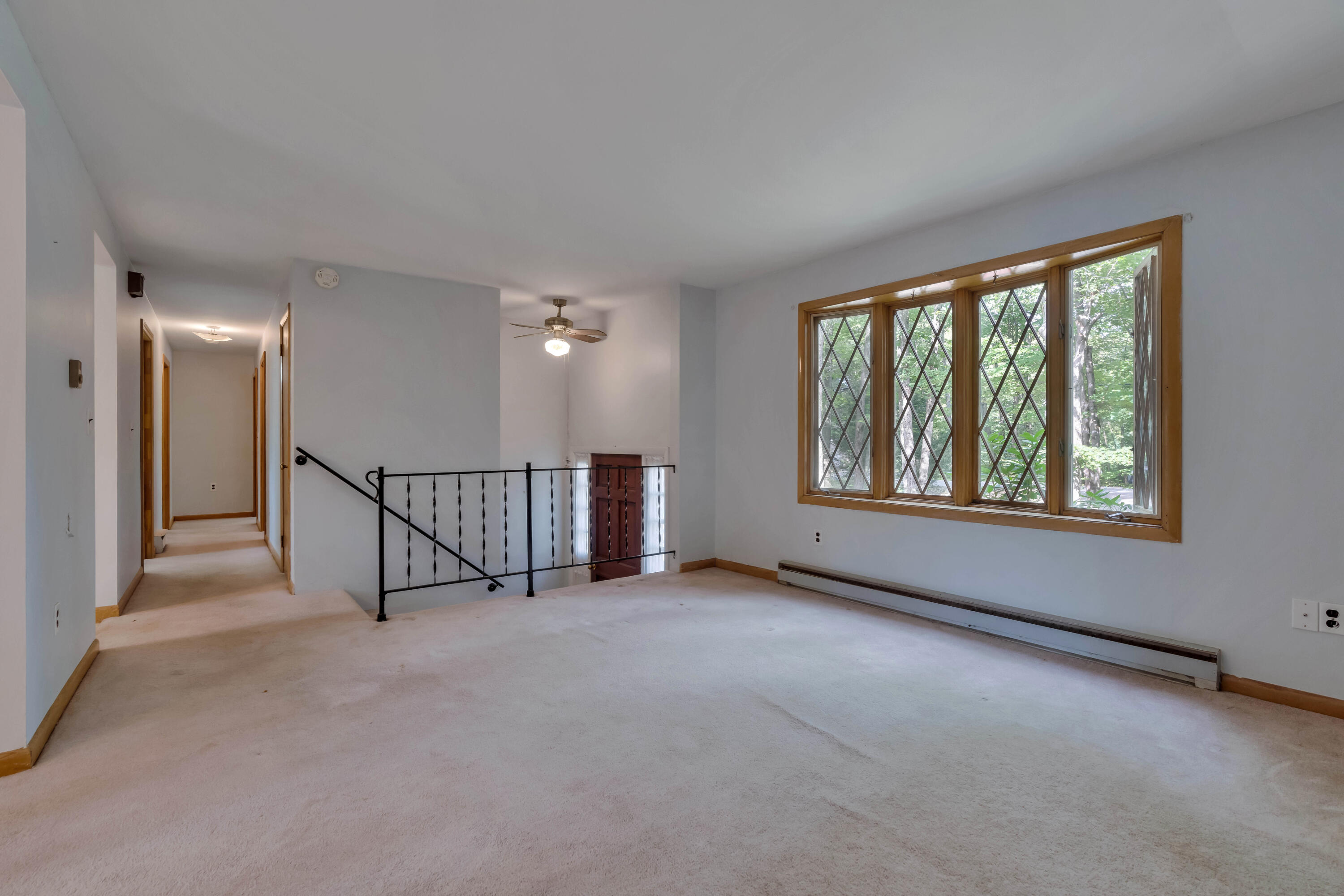 Hallway to bathroom and three bedrooms