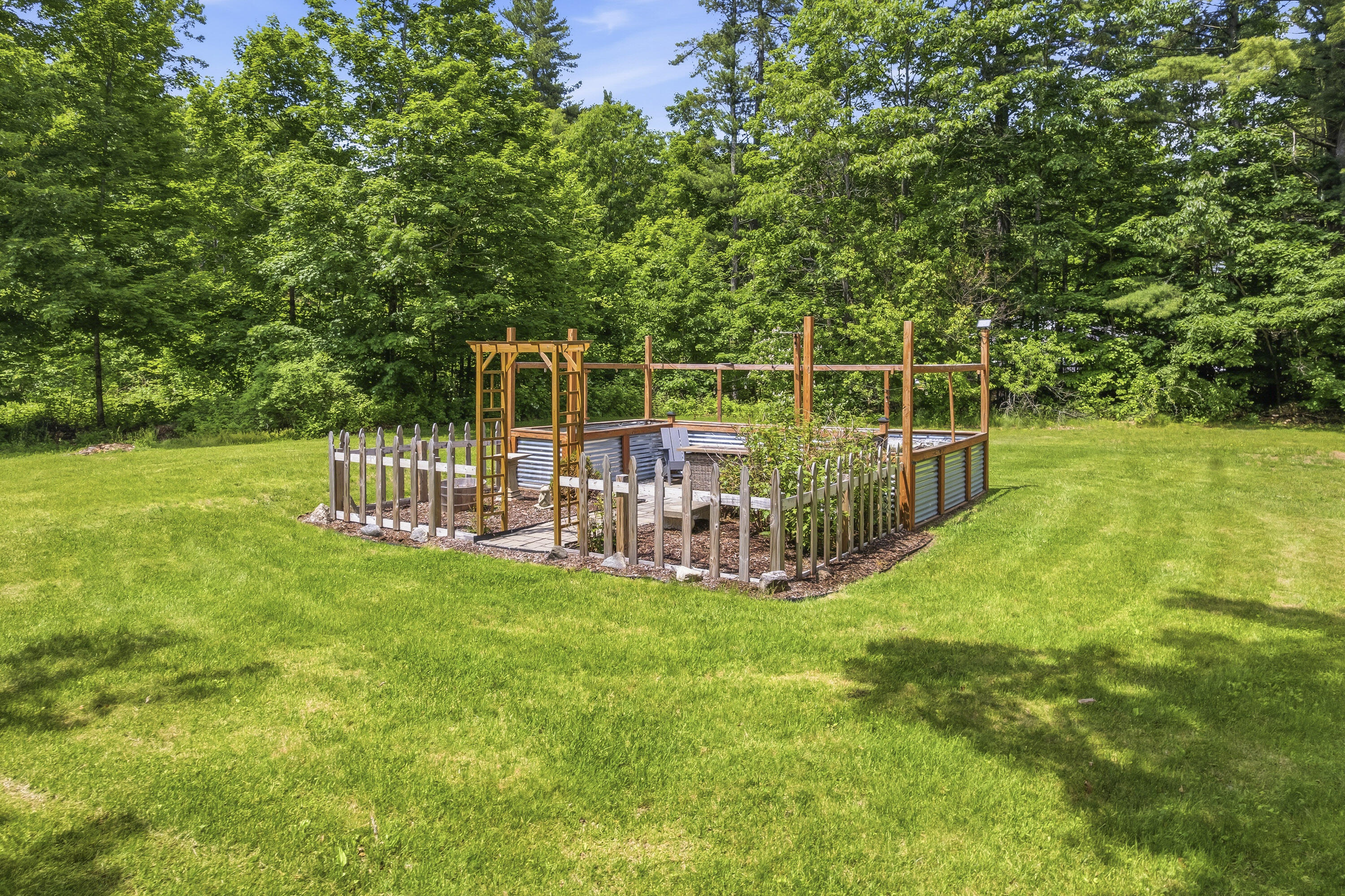 Fenced in garden with raised beds