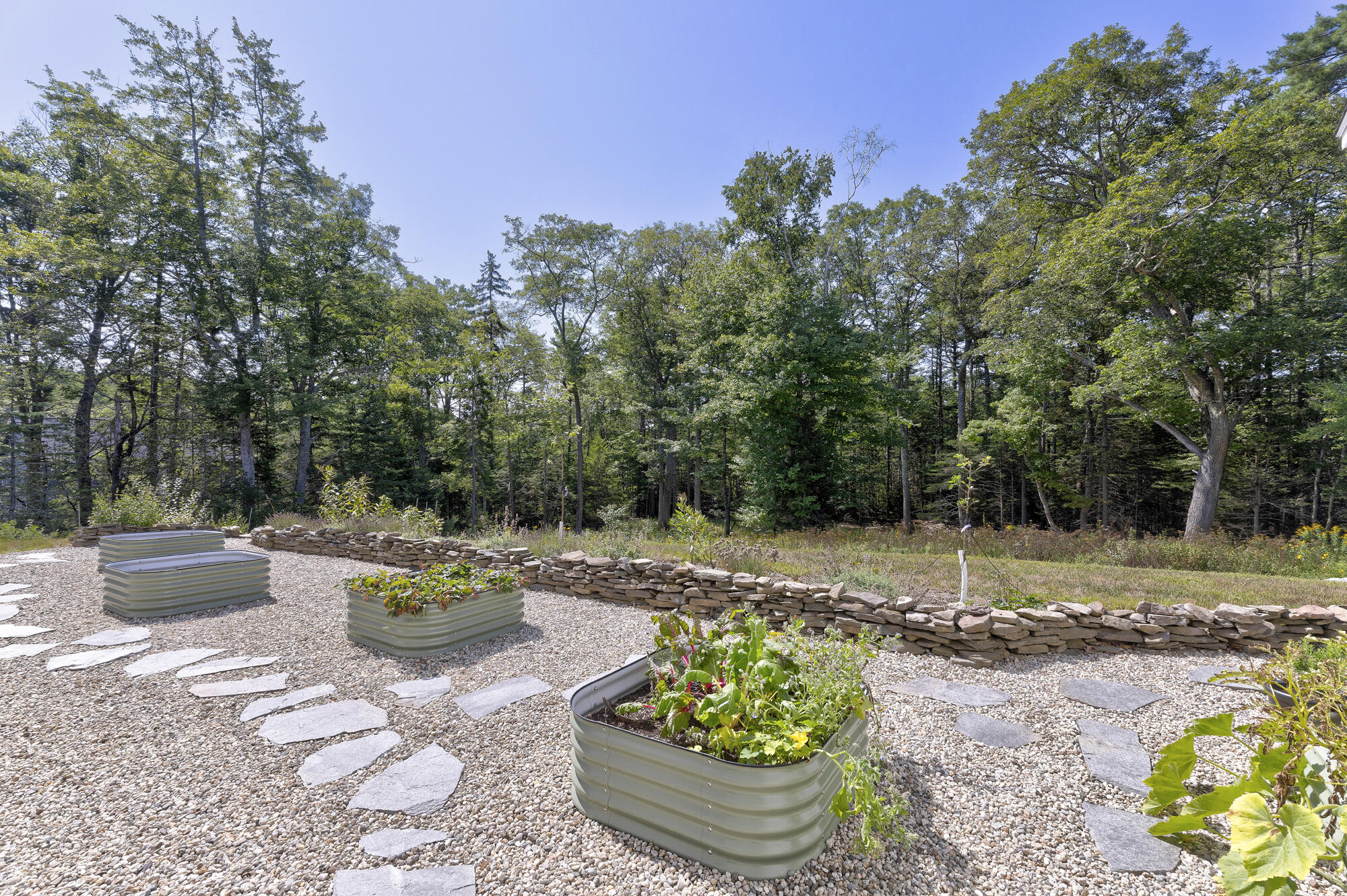 Raised beds and a decorative stone wall