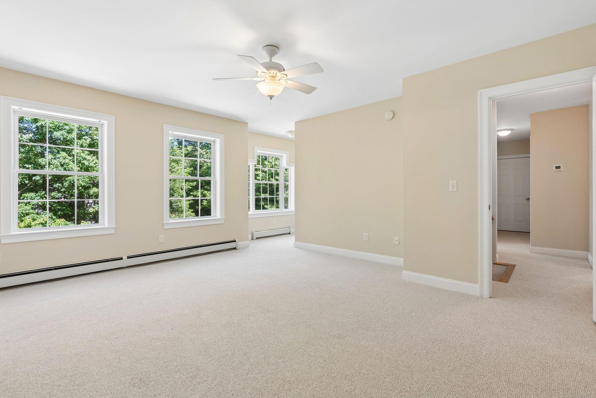Primary bedroom with walk-in closet