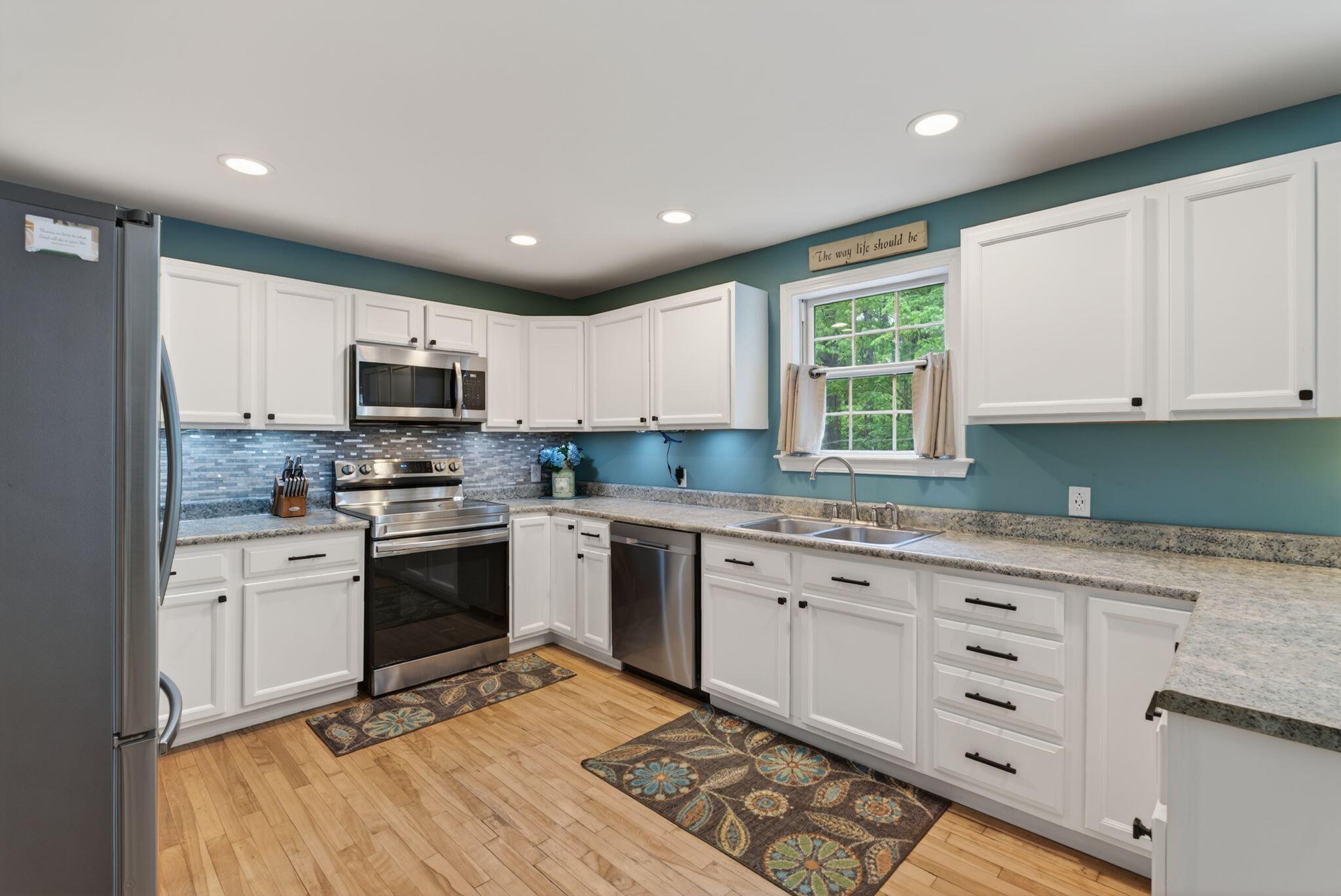 Kitchen with walk in pantry and access to backyard deck