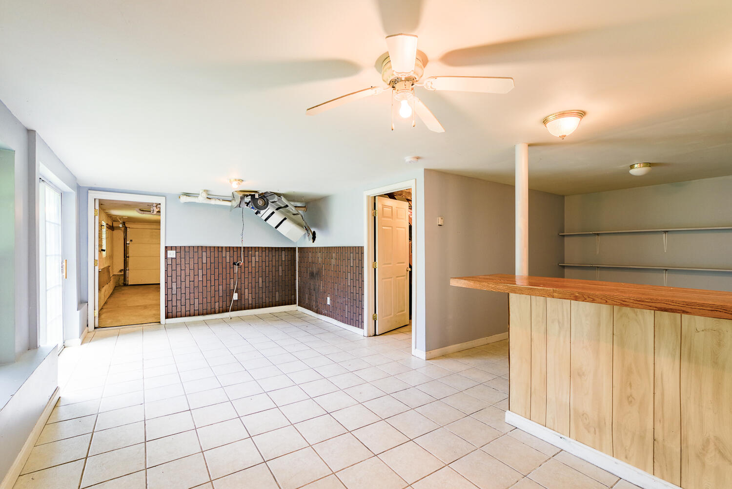 Endless possibilities! Door goes out to double garage.