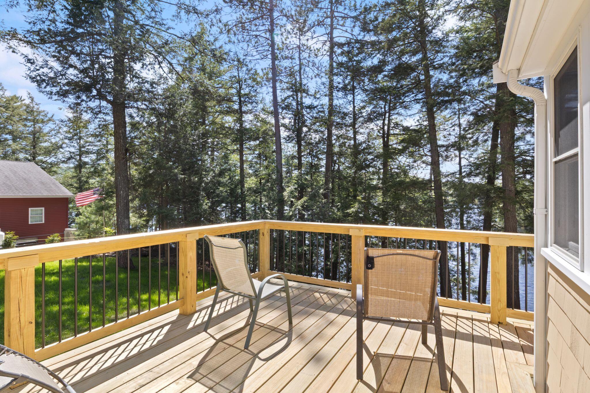 New deck off the primary bedroom that wraps around the back of the house